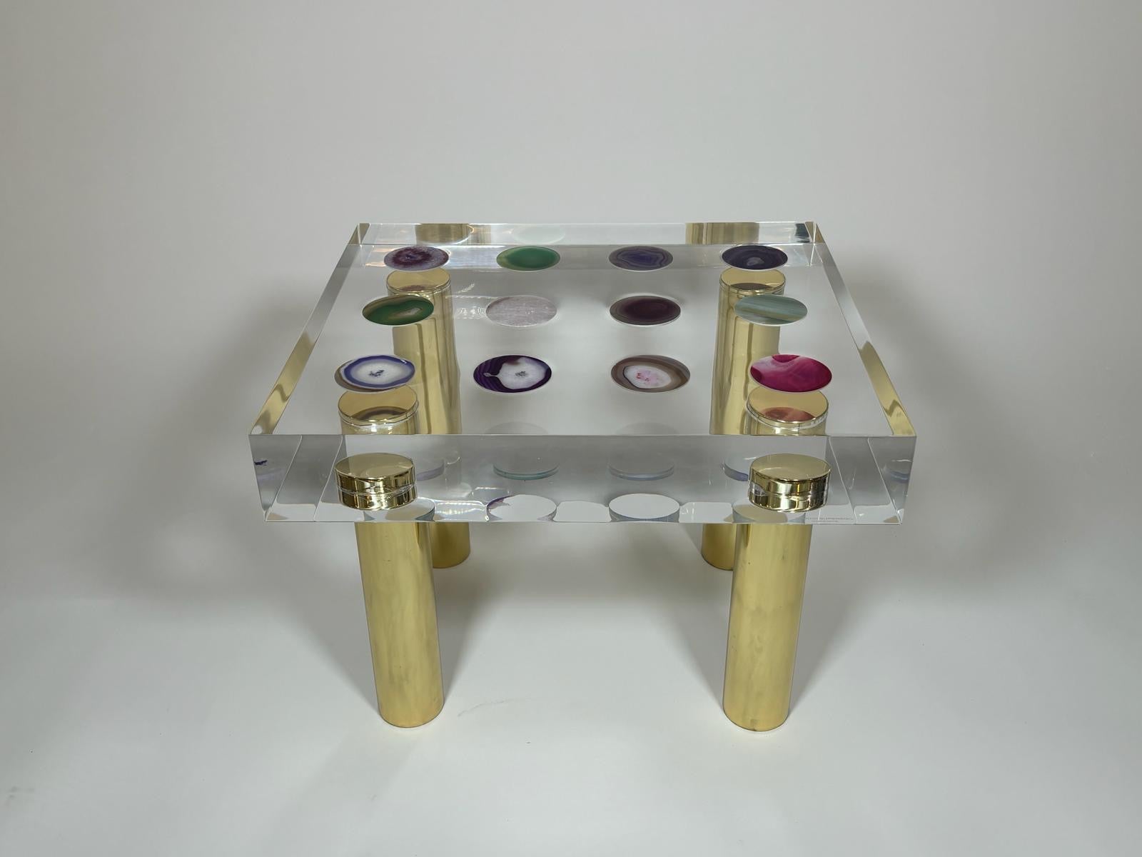 Acrylic glass construction reduced to basic geometric shapes, rectangular table top with agate inlays, four polished brass legs designed by Studio Superego for Superego Editions. Signed.

Biography
Superego editions was born in 2006, performing a