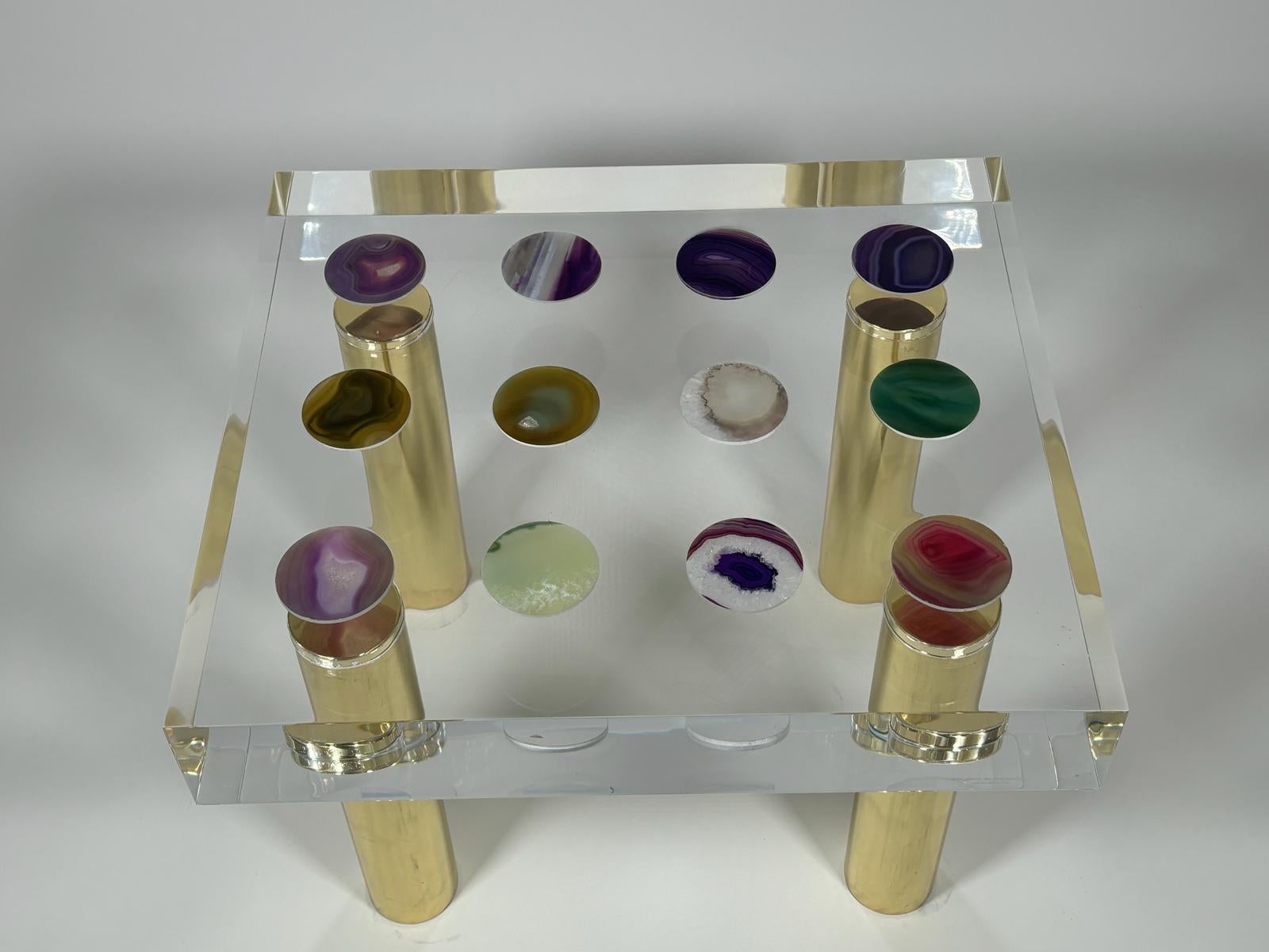 Acrylic glass construction reduced to basic geometric shapes, rectangular table top with agate inlays, four polished brass legs designed by Studio Superego for Superego Editions. Signed.

Biography
Superego editions was born in 2006, performing a