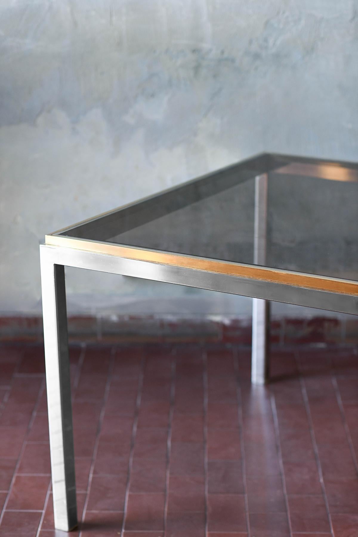 Italian Coffee table in brass and chromed metal with smoked glass shelves, Italy 1980 For Sale