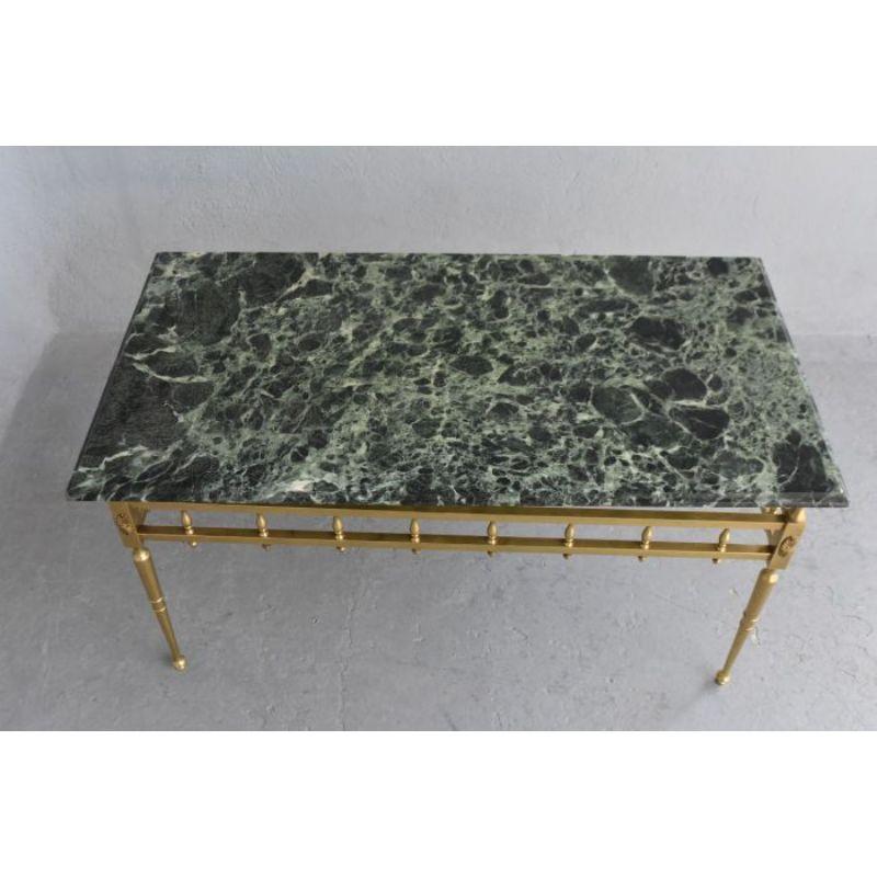 Coffee table in brass and green marble 1950 of elegant proportion. Height dimension 49 cm for a width of 95 cm and a depth of 50 cm.

Additional information:
Style: 40s 60s
Material: Brass.