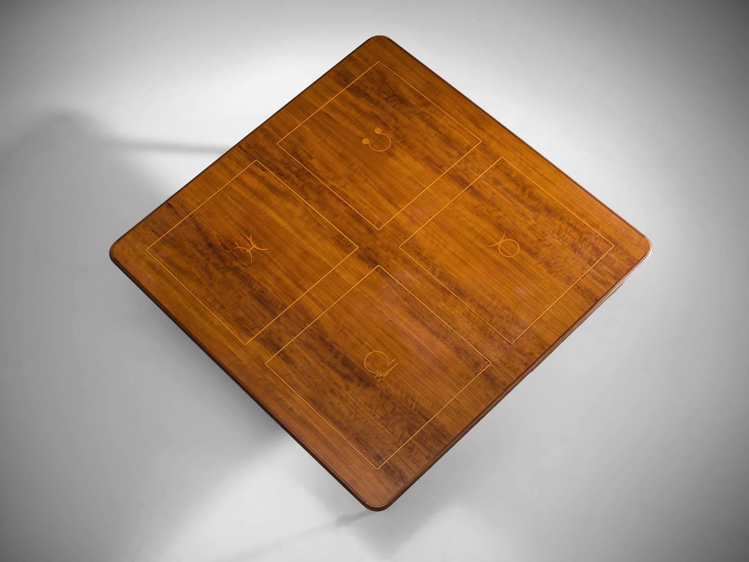 Coffee table, brass, rosewood, Europe, circa 1950.

This square coffee has a simple, effective design. The top features a rosewood square with inlayed brass zodiac signs. The conical legs feature a circle with a brass rim at the bottom. The effect