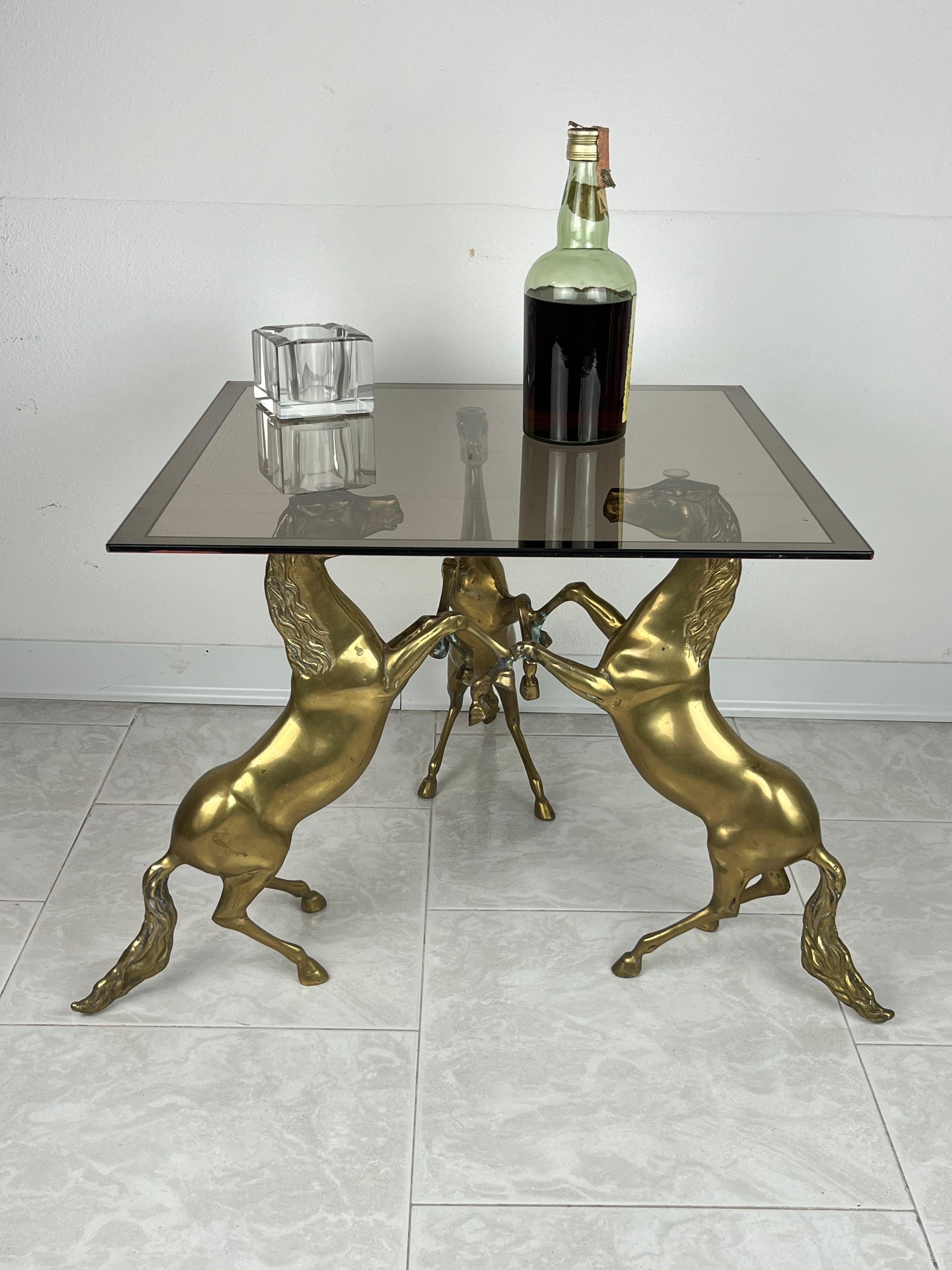 Coffee table in brass and smoked glass top, Italy, 1960s
Found in a noble apartment. Intact and in good condition. Small signs of aging.