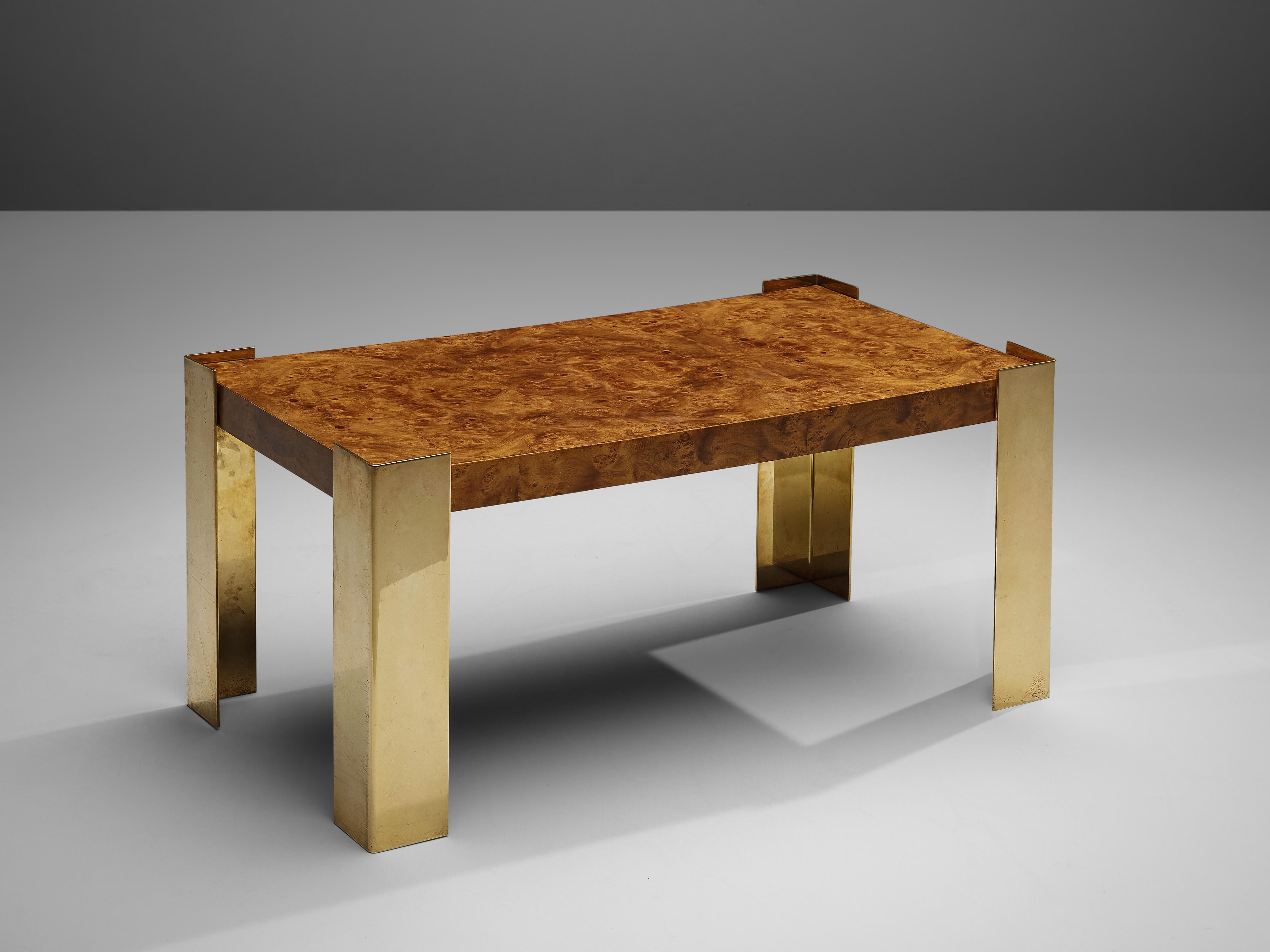 Coffee table, brass, walnut burl, Belgium, 1980s.

Belgian coffee table in glamorous look. Both the legs in brass and the vivid tabletop create an admirable design. The rectangular thick tabletop in walnut burl features a wonderful dynamic