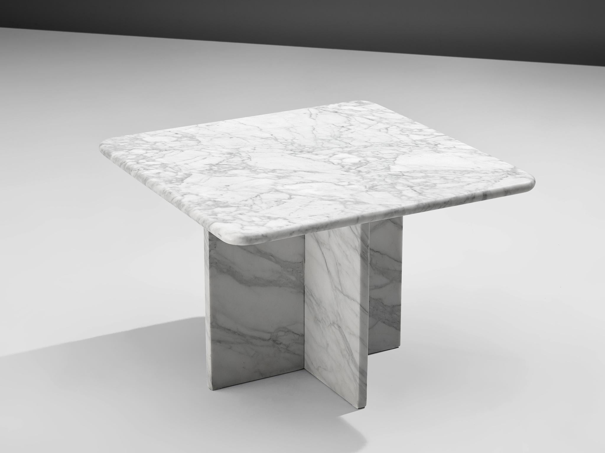 Coffee table, marble, Italy, 1970s

This  coffee table in marble features an interesting pattern in the marble. The square tabletop has round edges and is based on an x-shaped base. The aesthetics are archetypical for postmodern design, with a