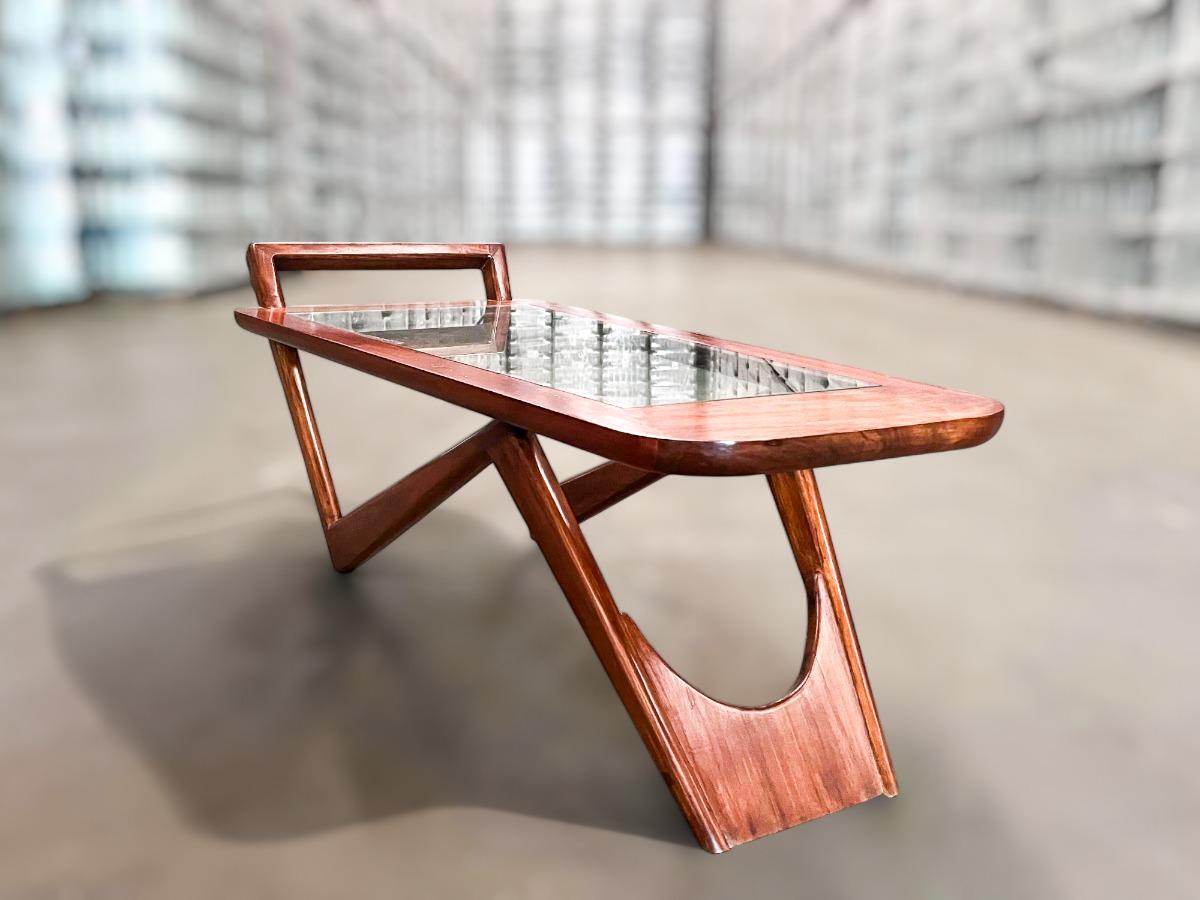 **Available Now: Spectacular Coffee Table by Pierre Weckxx**

This stunning coffee table, crafted in the 1950s from Caviuna wood and glass, is truly a standout piece!

The wood has been meticulously refinished and is in excellent condition. Its