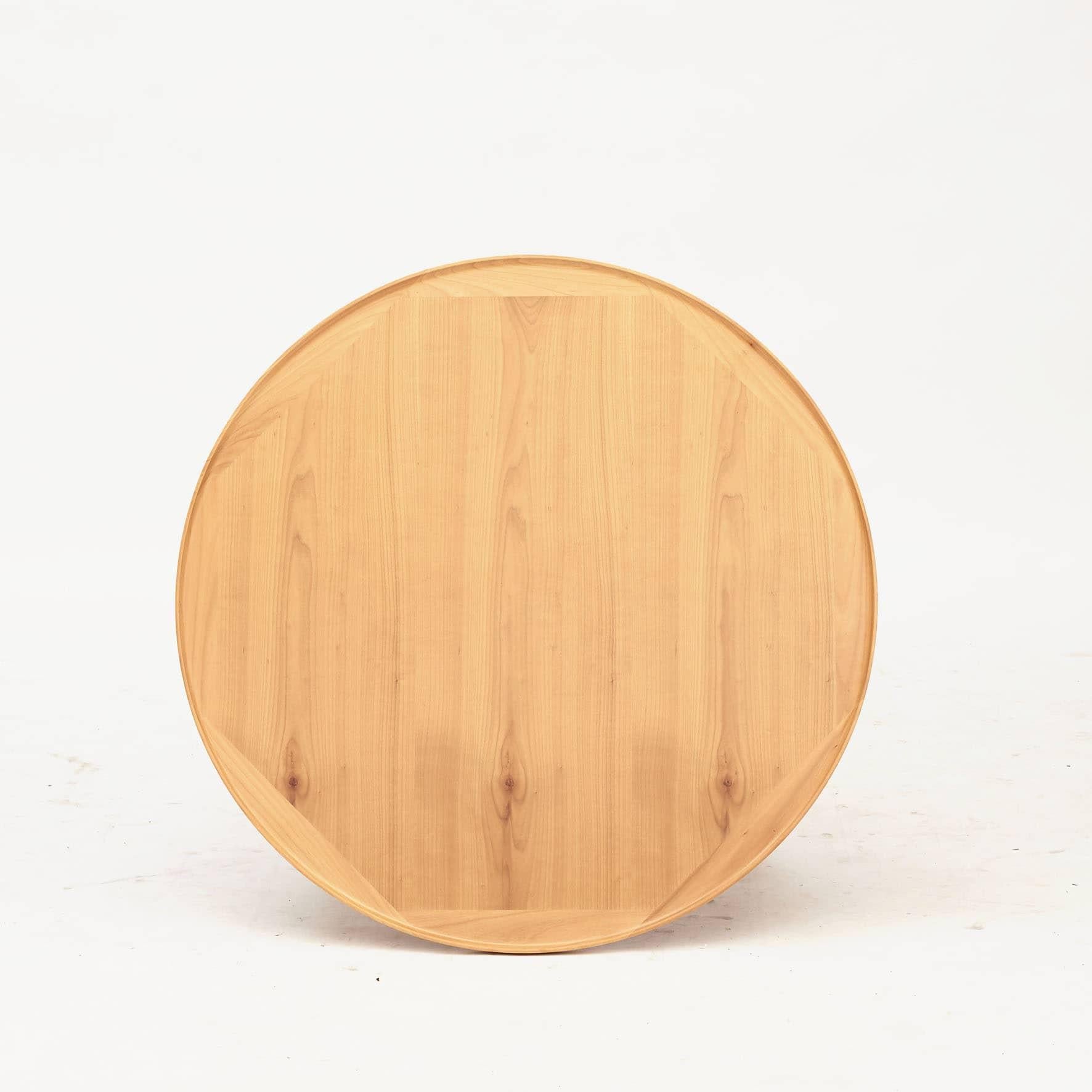 Round coffee table in solid cherry wood.
Table top with raised edge and cross frame.

Vagn Leo Jacobsen (1932 - 2013) was a Danish cabinetmaker and manufacturer.

He was apprenticed in 1953 to C.B. Hansen's Establishment with a silver medal. Vagn