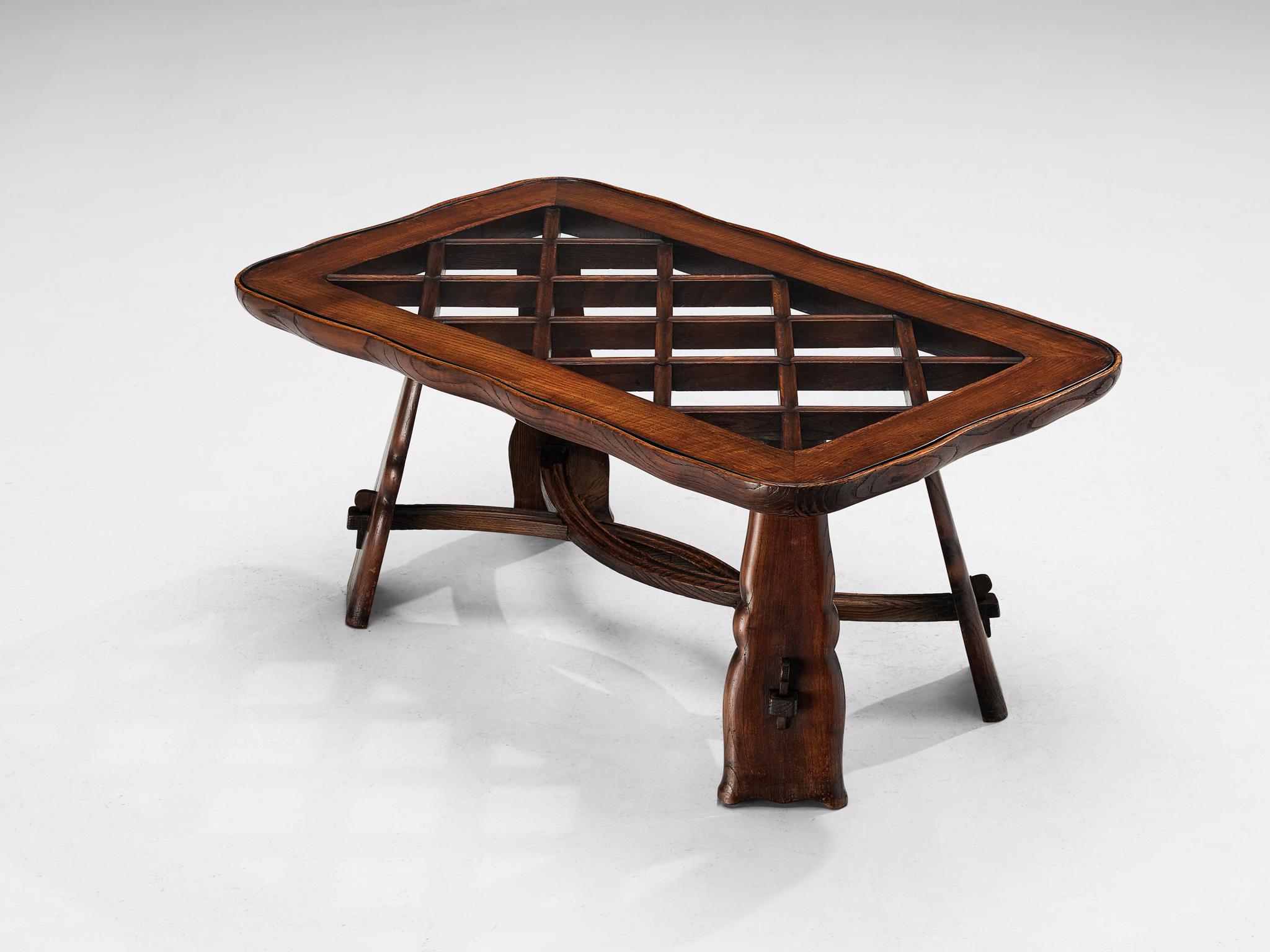 Valabrega Studio, coffee table, chestnut, glass, Italy, circa 1935

The Valabrega furniture studio once again proves its great eye for materialization and impeccable craftsmanship this piece is exemplary for. The design of the table draws