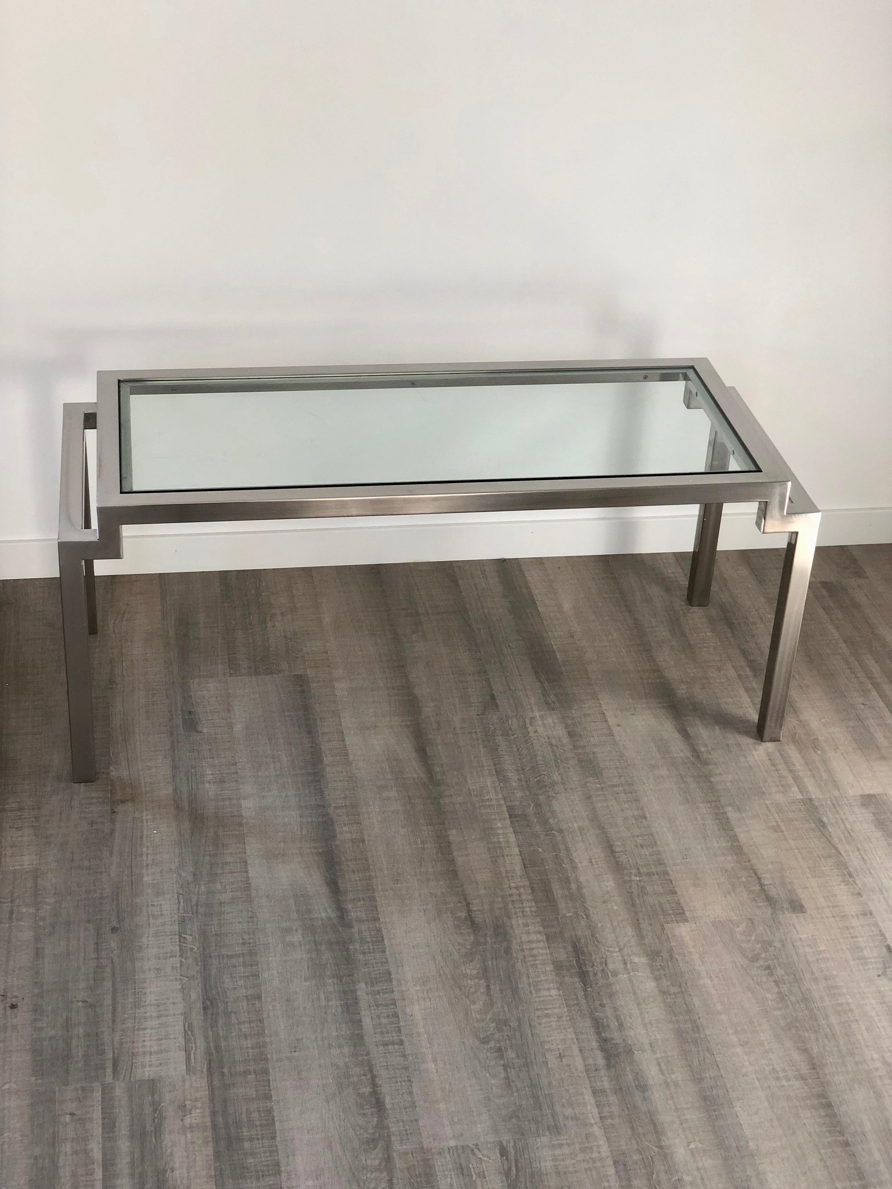 Design coffee table in chrome and glass made in Italy, circa 1970.
In the style of Cy Mann.