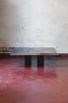 Coffee table in chromed metal, black glass top and black lacquered wooden feet