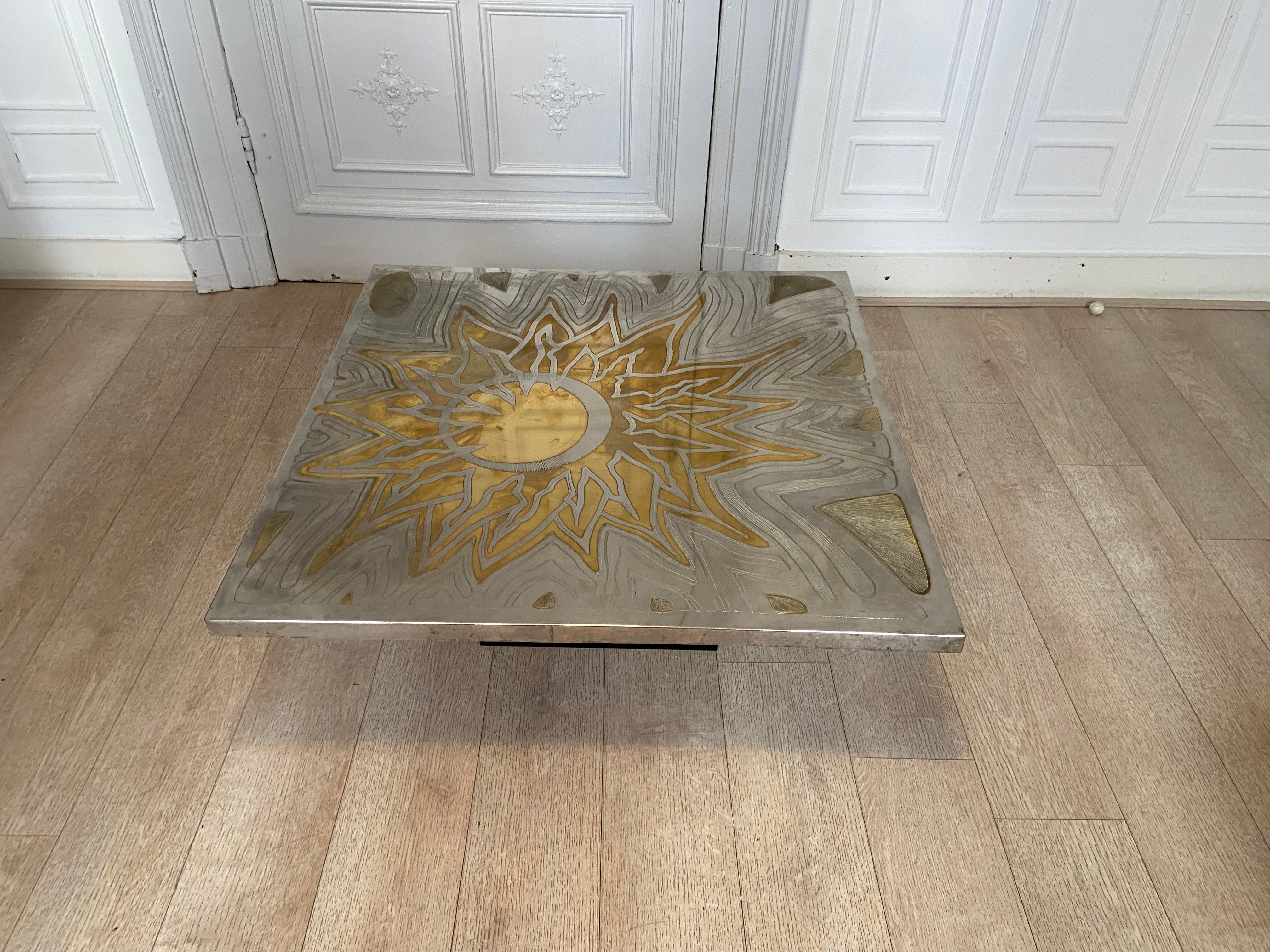 Brass coffee table engraved with solar motif signed by designer christian krekels. Good vintage condition.