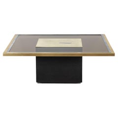 Coffee table in gilded brass and smoked glass. 1970s.
