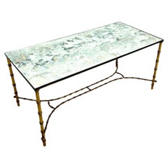 Tavolino in bronzo dorato e specchio di Maison Baguès