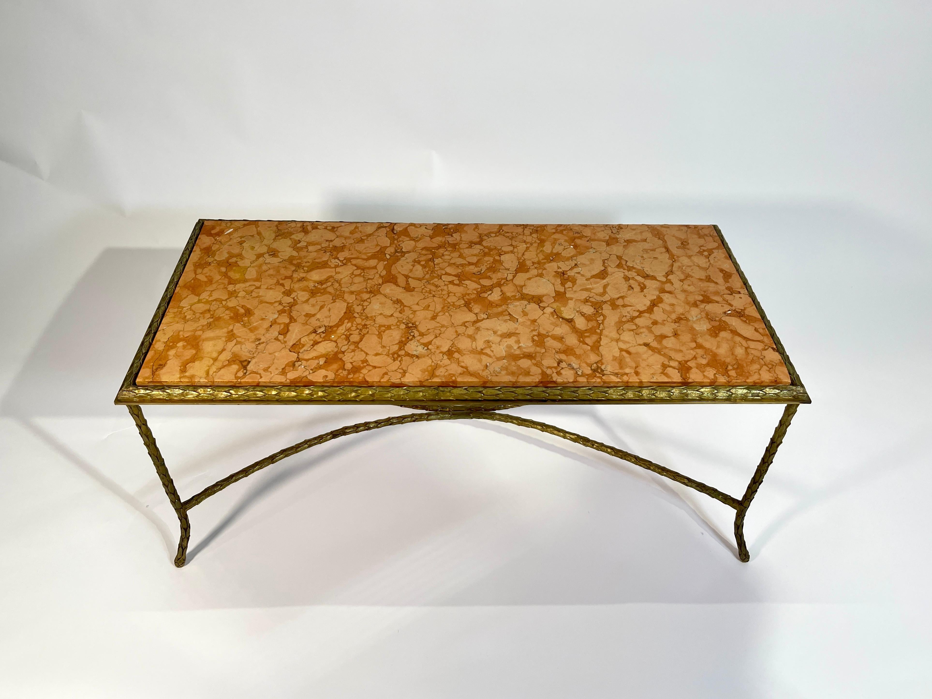 Coffee table by Maison Baguès in gilt bronze, white original marble top.

Since its establishment in 1860, the Maison Baguès has been an emblem of French sophistication in luxury lighting design. Each piece the firm makes is hand assembled using