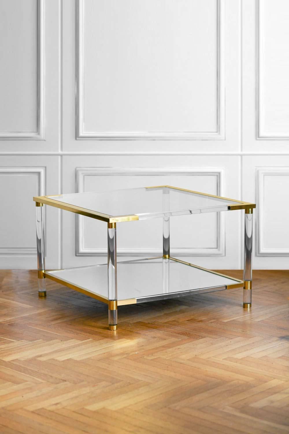 Coffee table in glass, mirrored glass, methacrylate and brass. 
Italian production, 1970s
Product details
Dimensions: 79 W x 50 H x 79 D cm