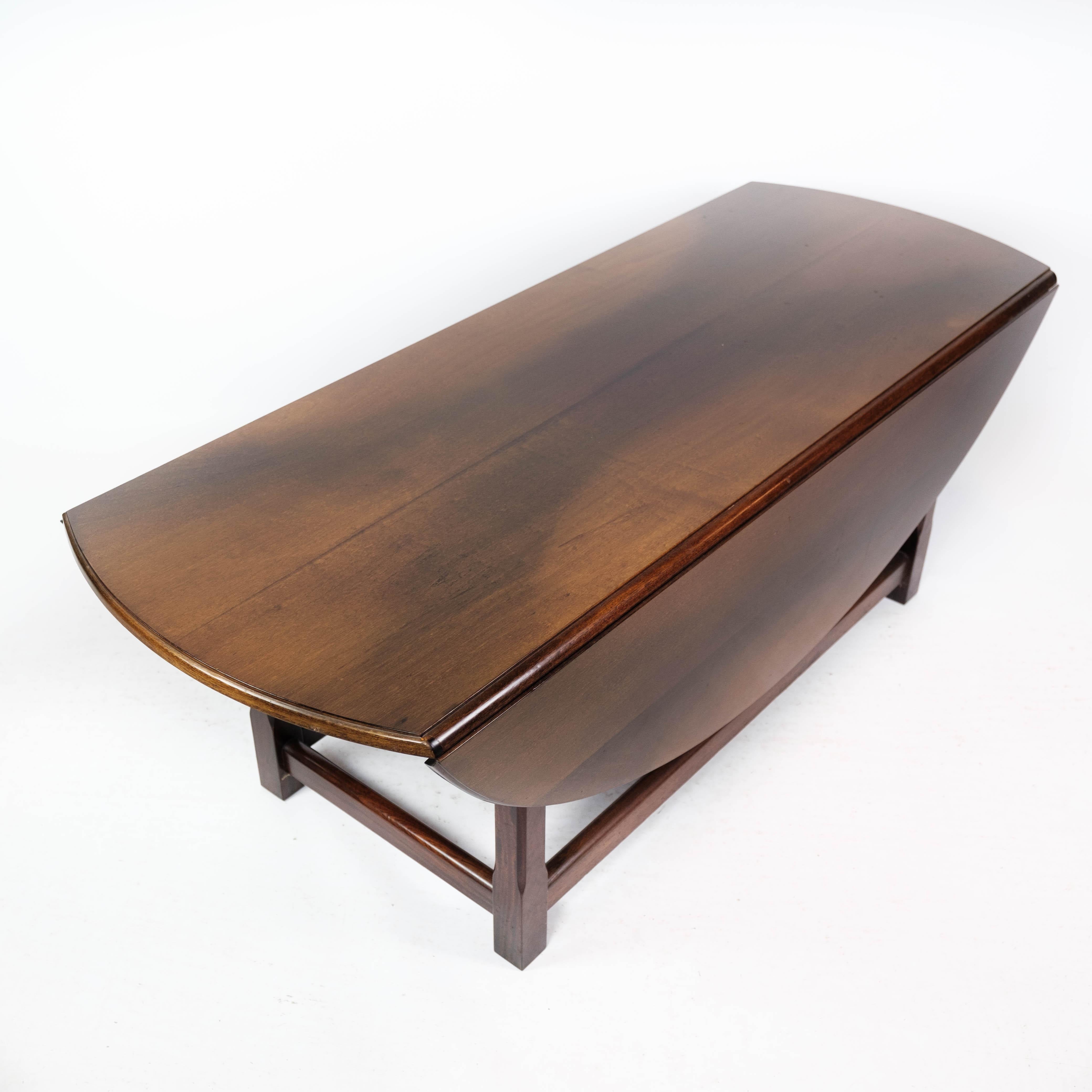 This exquisite coffee table, crafted from rich mahogany, embodies the timeless elegance of the 1930s design era. Its classic design and impeccable craftsmanship make it a stunning addition to any living space.

The mahogany wood lends a warm and