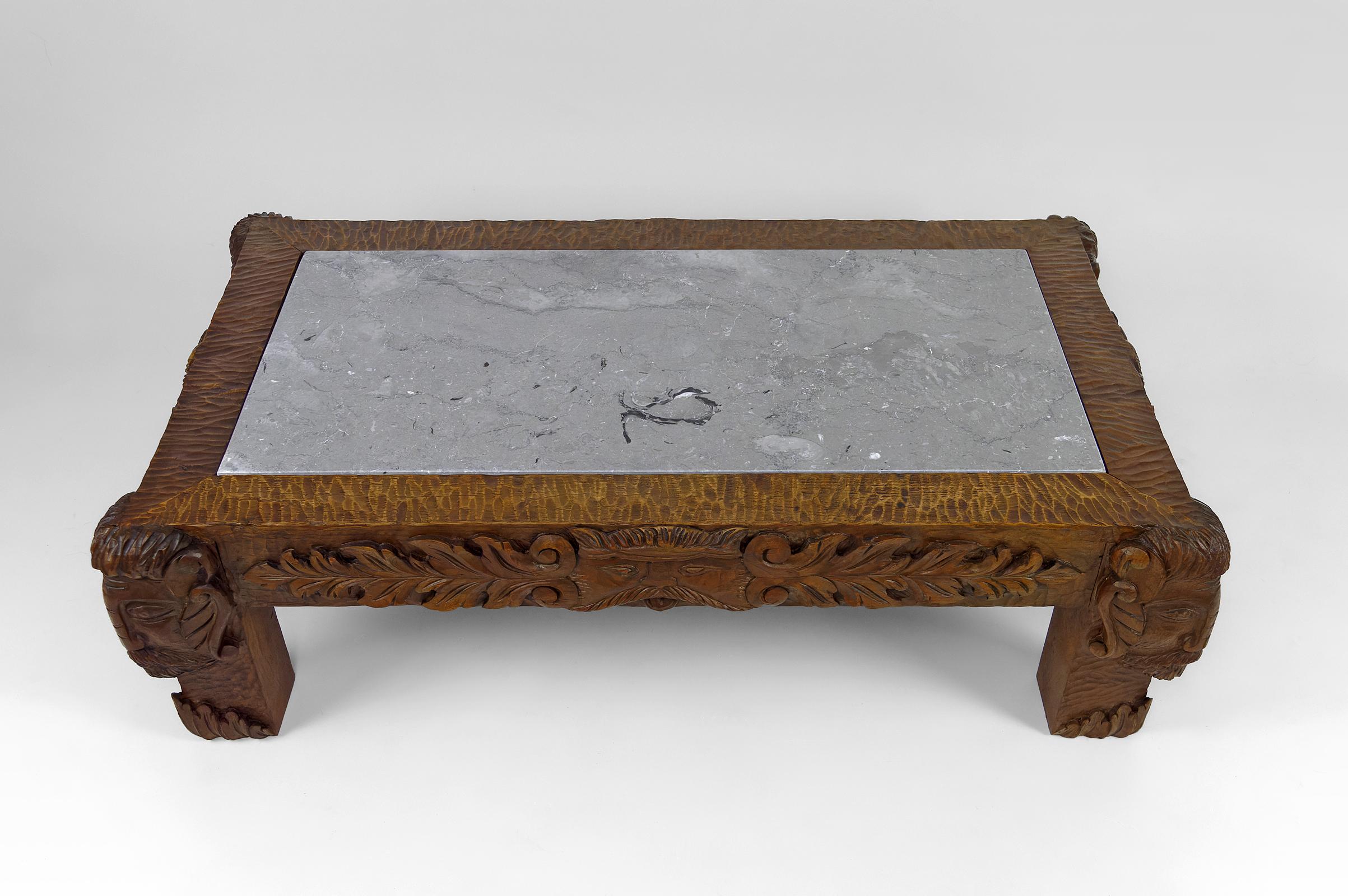 Coffee table in oak carved with faun heads and marble top, France, Circa 1940 For Sale 1