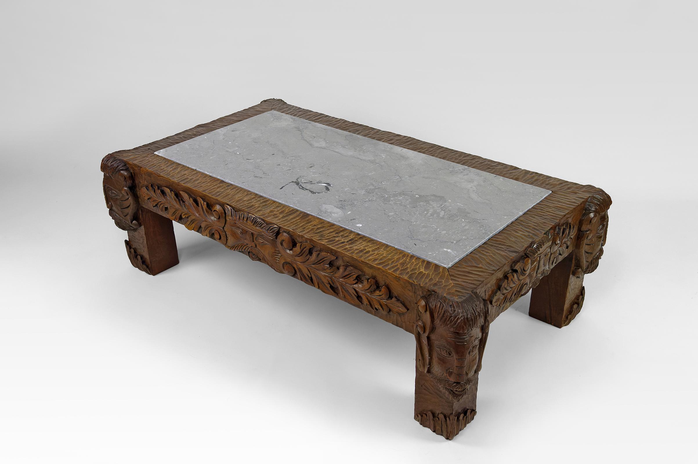 Mid-20th Century Coffee table in oak carved with faun heads and marble top, France, Circa 1940 For Sale