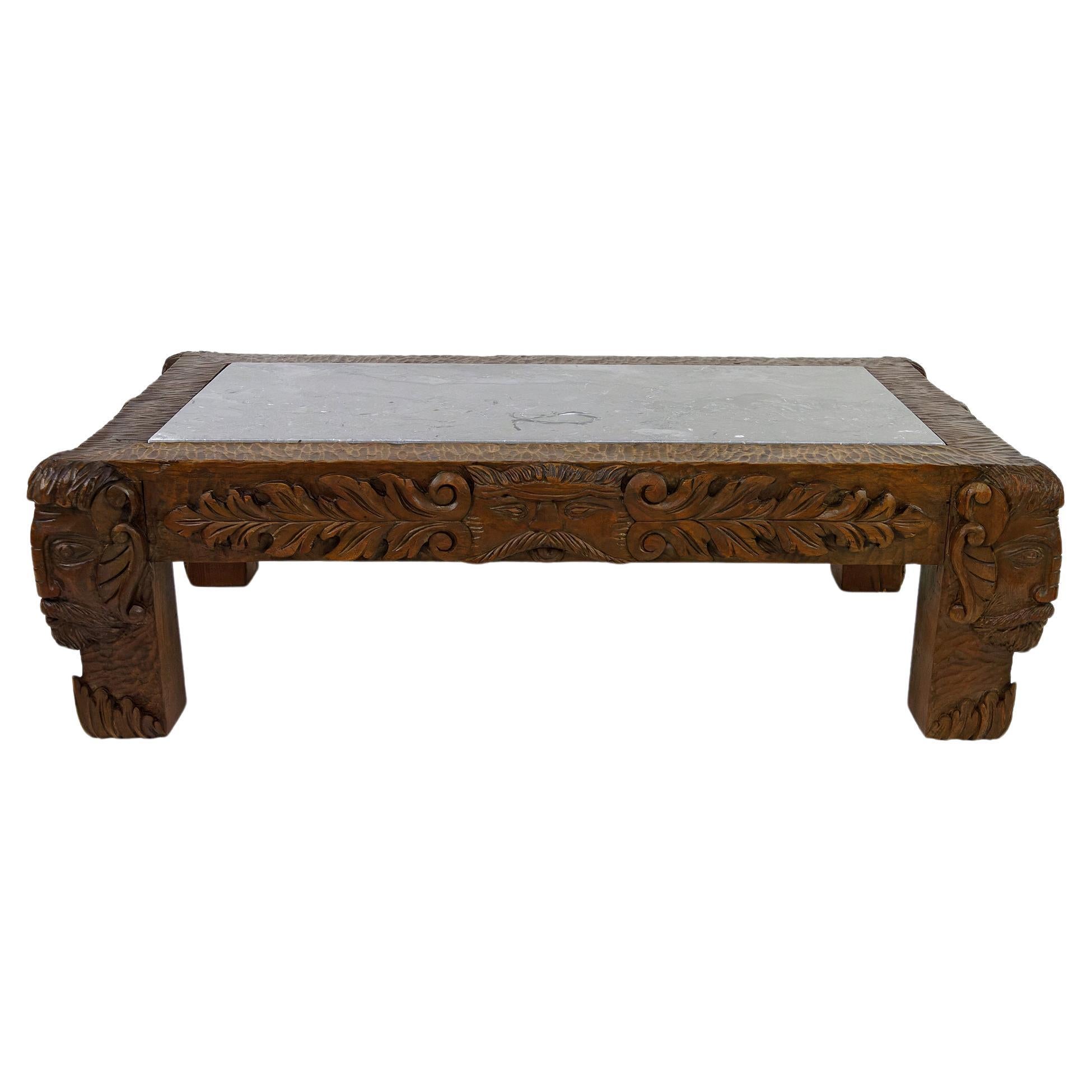 Coffee table in oak carved with faun heads and marble top, France, Circa 1940 For Sale