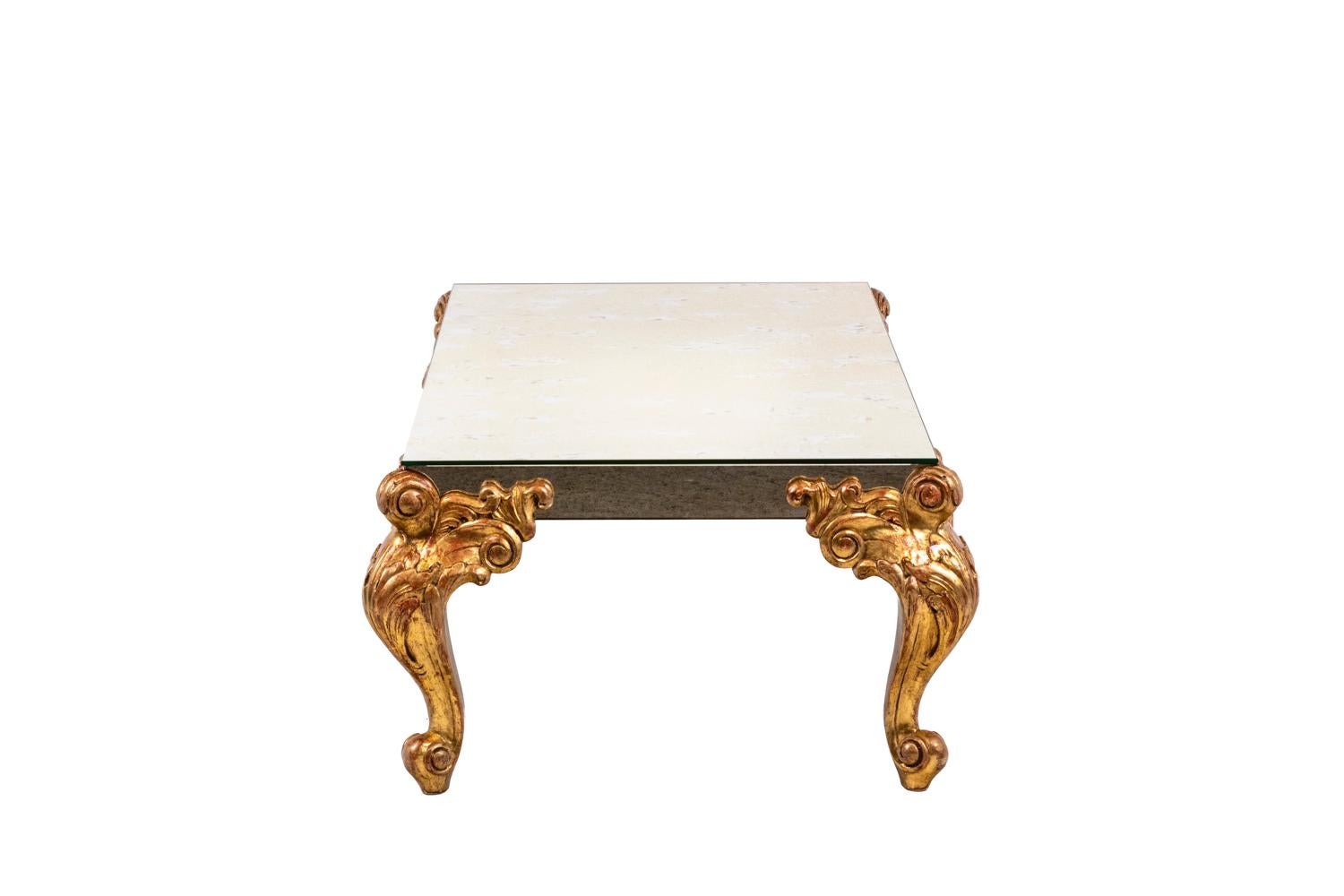 Maison Jansen, in the style of.

Coffee table. Tray in oxidized mirror, or aged effect. Base in gilded and carved wood.

Dimensions: H 40 x L 122 x P 70 cm.

 