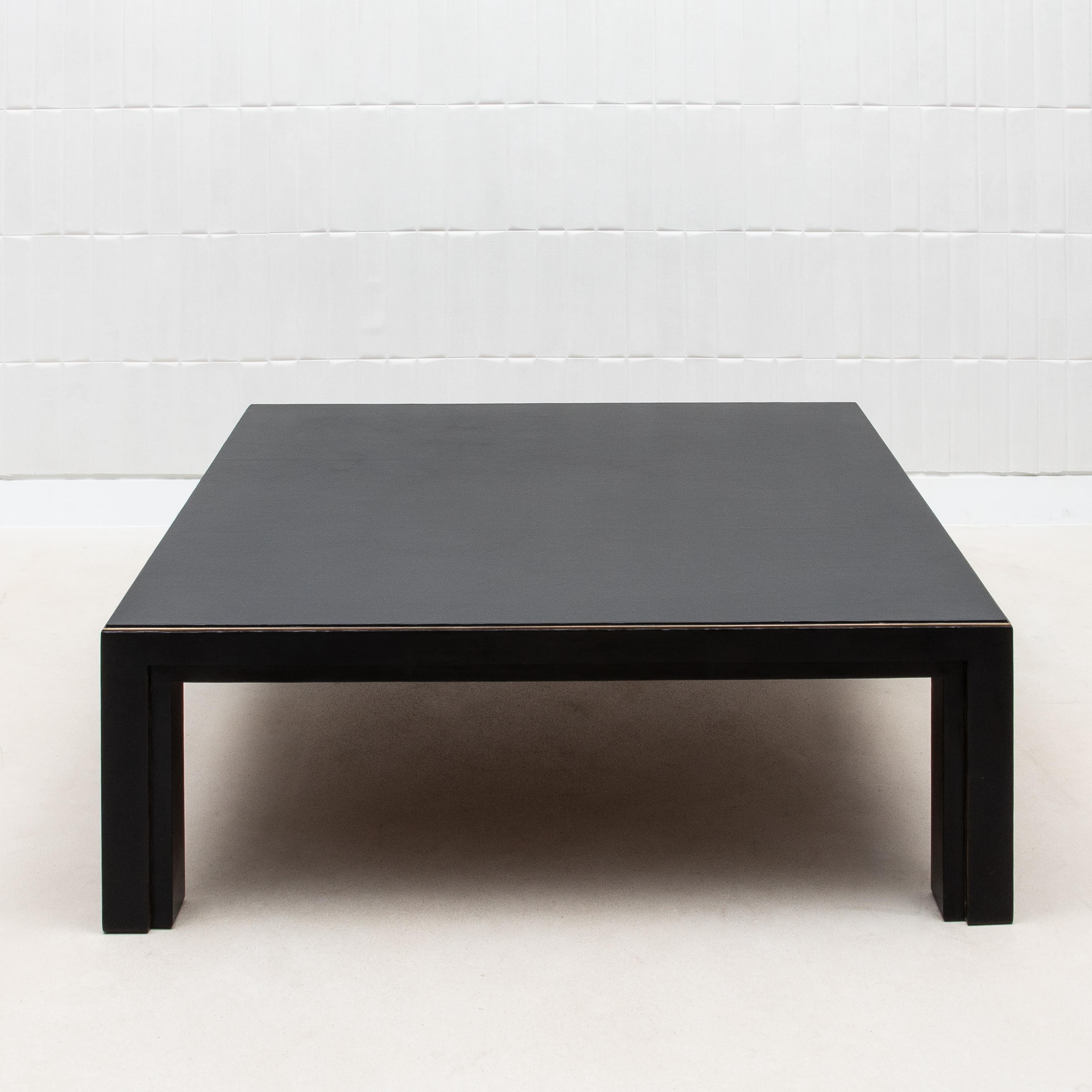 The Square Parson Coffee Table by R&Y Augousti is a refined embodiment of minimalist luxury, designed to bring a touch of understated elegance to any interior. Its sleek, geometric form is enhanced by a rich parchment surface, offering a smooth and