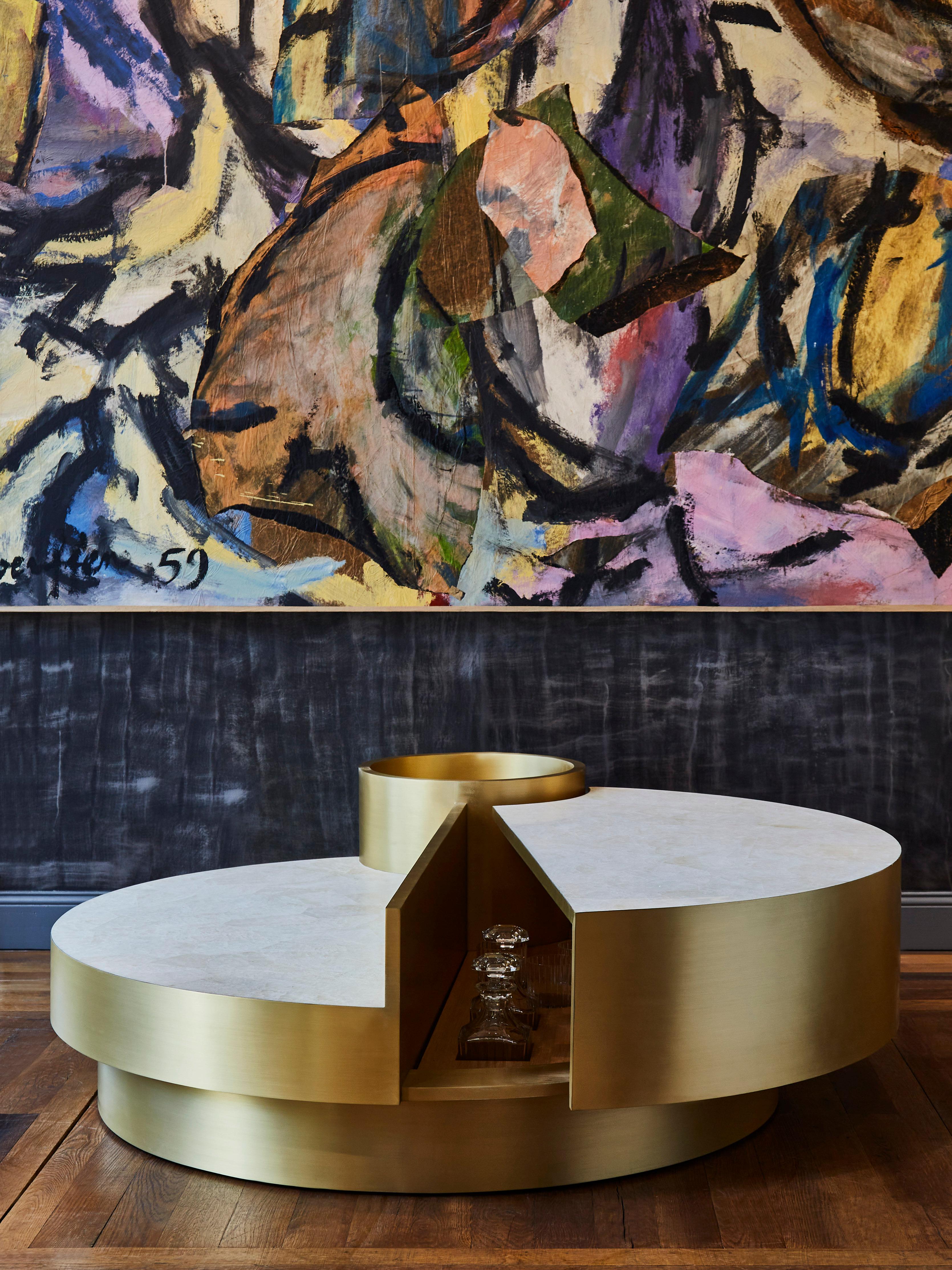 Stunning coffee table in the spirit of Mario Sabot. Top made of rock crystal marquetry and brushed brass. 
Can be open to discover a wooden interior with slots for glasses and / or bottles. 
Creation by Studio Glustin.