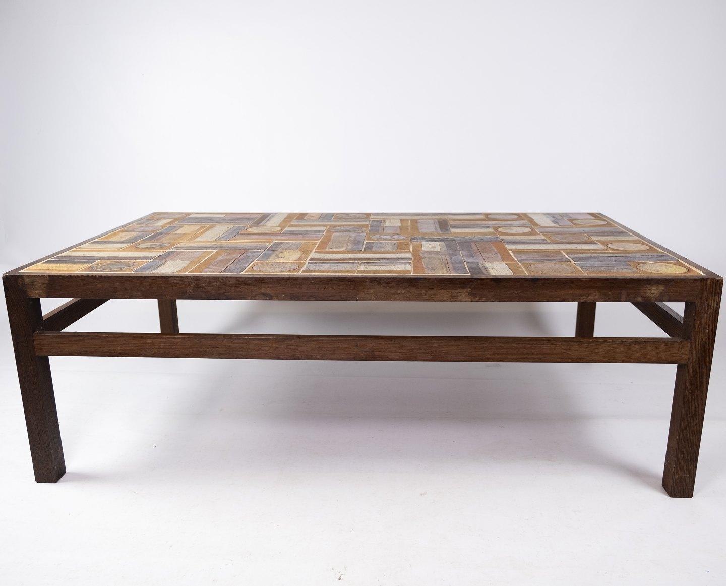 Coffee table in rosewood and dark tiles, designed by Tue Poulsen from the 1970s. The table is in great vintage condition.
Measures: H 45 cm, W 134 cm and D 80 cm.