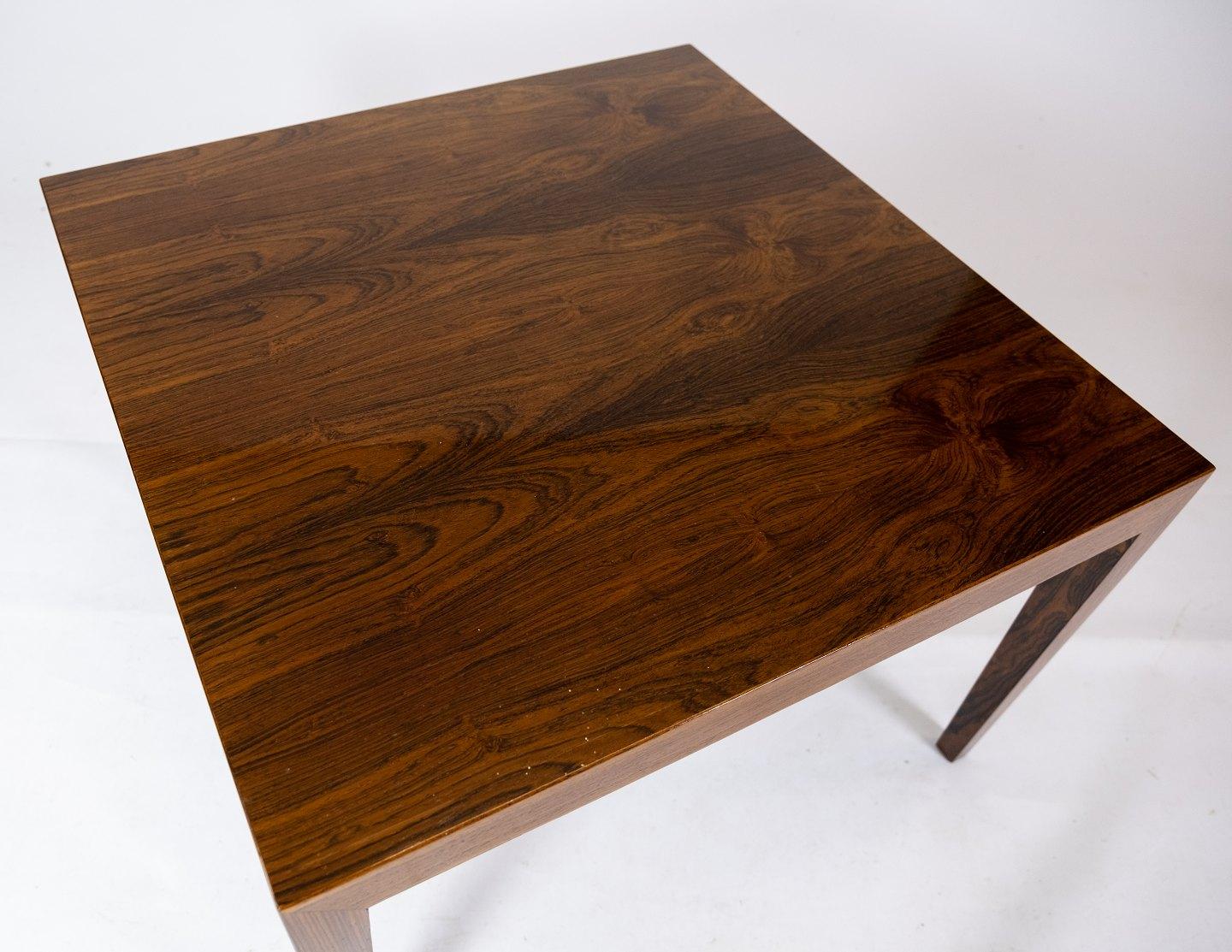 This coffee table, crafted from luxurious rosewood, embodies the elegant simplicity of Danish design from the 1960s. Designed by the renowned Severin Hansen for Haslev Furniture Factory, it reflects the era's emphasis on clean lines, functionality,