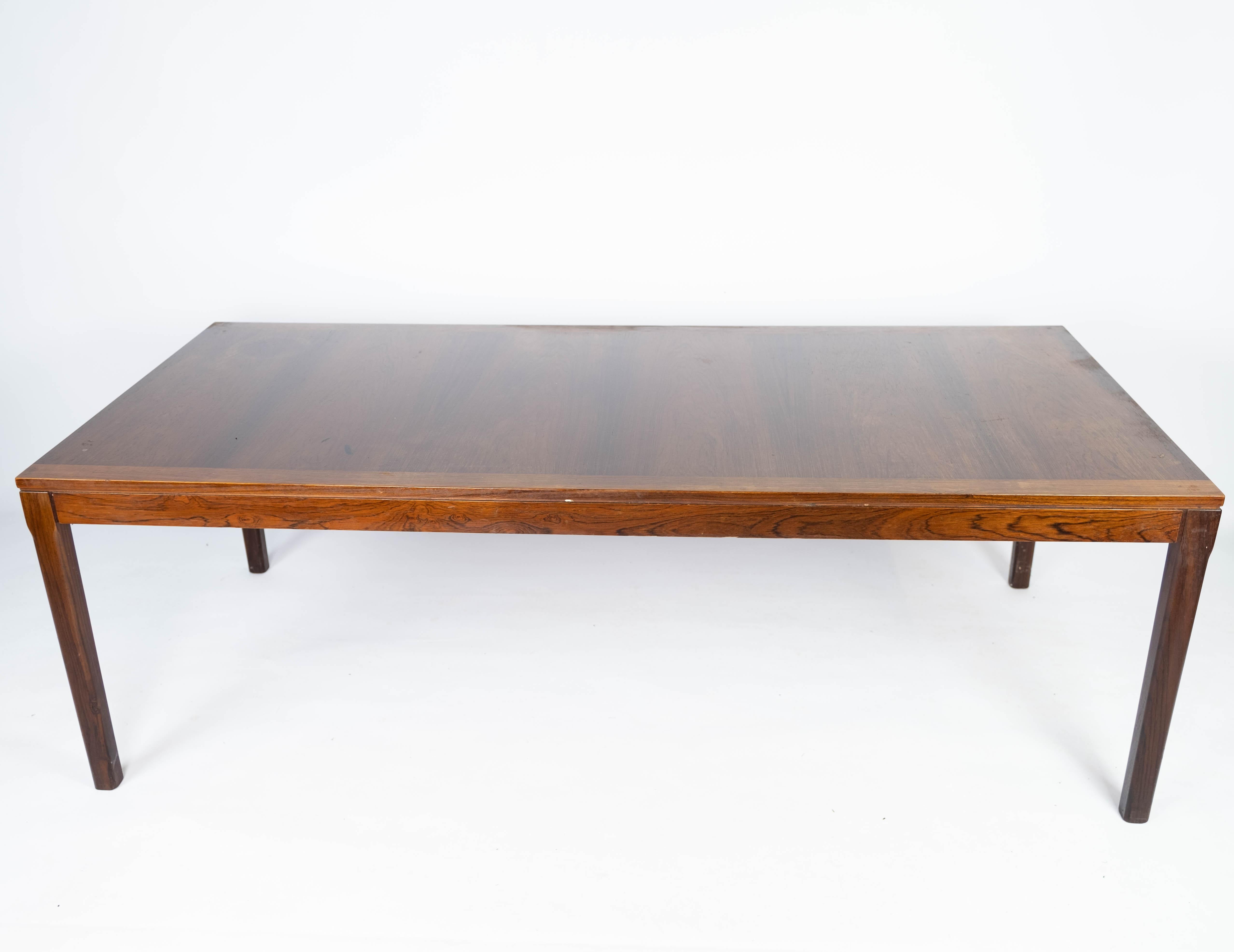 This rosewood coffee table epitomizes the elegance and craftsmanship of Danish design from the 1960s. Crafted with precision and attention to detail, it boasts a timeless appeal that adds sophistication to any living space.

The rich tones and grain