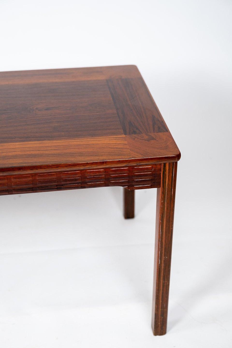 Vintage Danish Design Rosewood Coffee Table from the 1960s: a timeless piece that exudes elegance and sophistication.

Crafted from rich and luxurious rosewood, this coffee table epitomizes the iconic design ethos of mid-century Danish furniture.