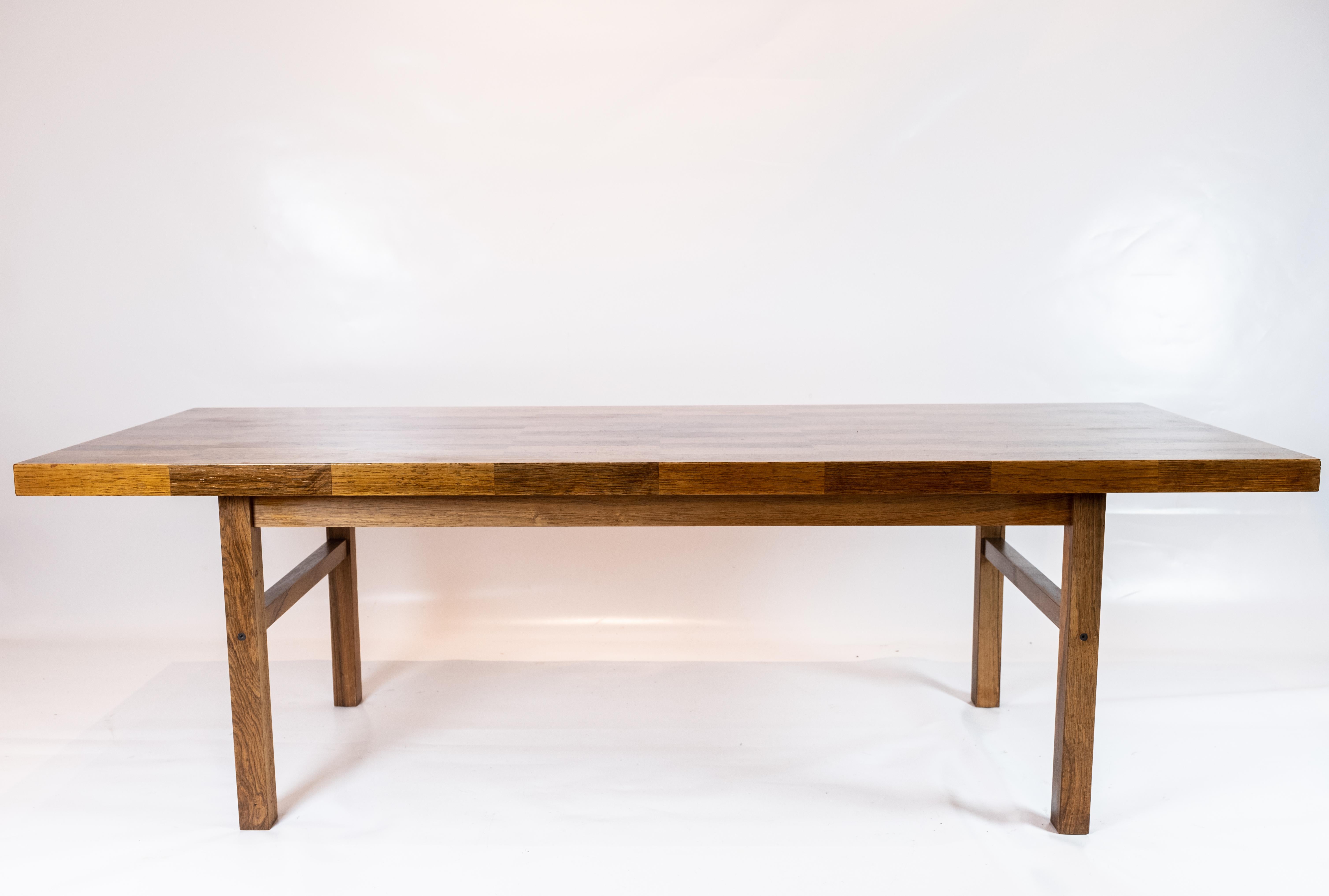 
This coffee table is a true testament to the timeless elegance of Danish design. Crafted from rich rosewood, it exudes warmth and sophistication, making it a stunning centerpiece for any living room.

Manufactured on the 14th of June 1967, this
