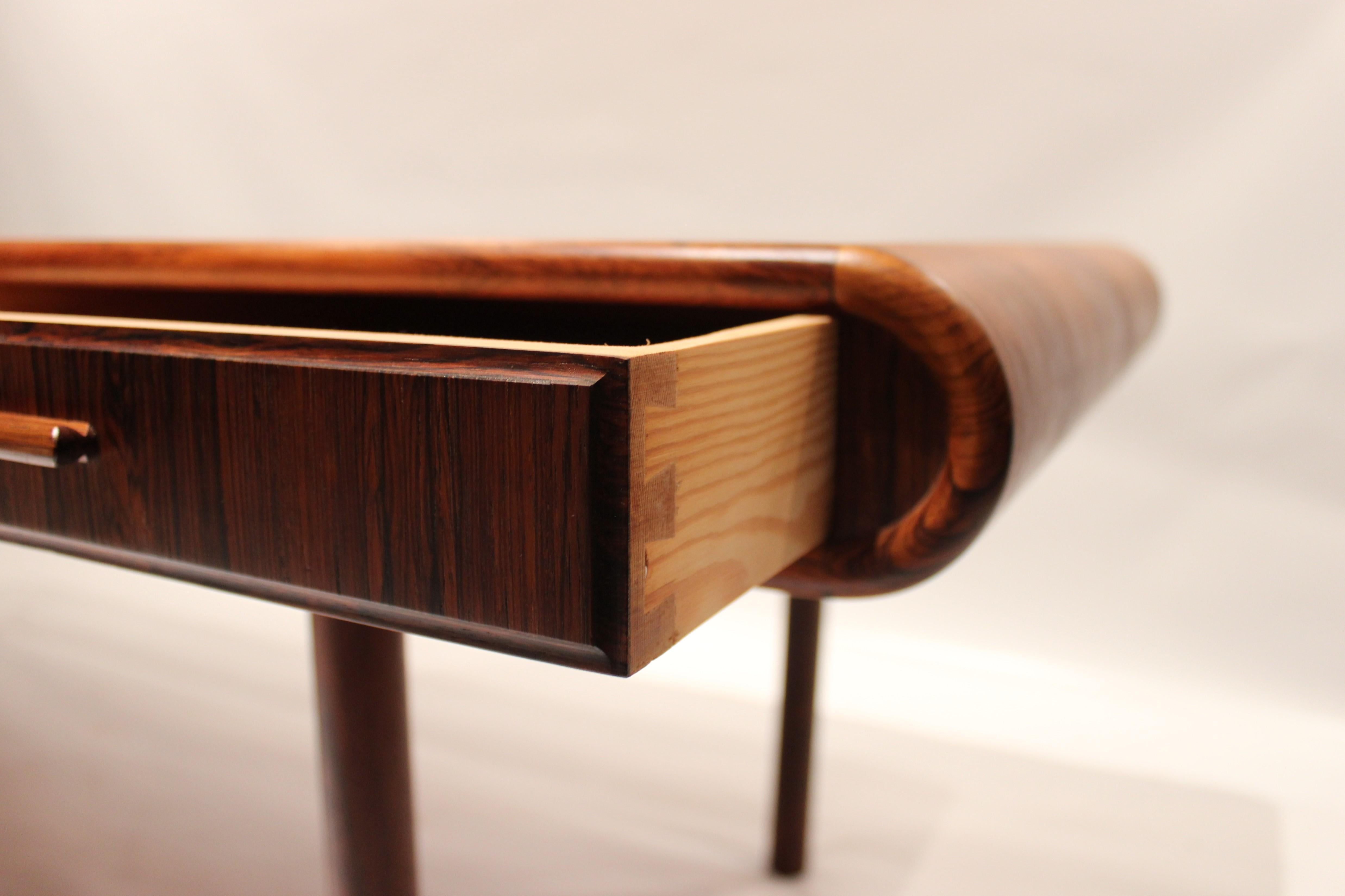 Scandinavian Modern Coffee Table in Rosewood with Curved Edges of Danish Design from the 1960s