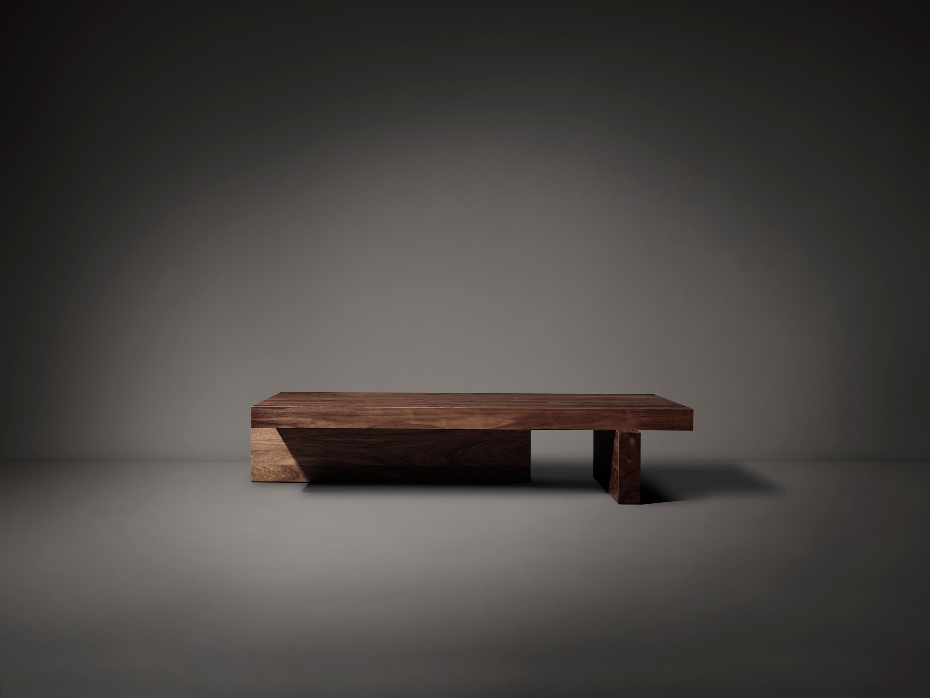 Inspired by the simplicity of traditional Japanese architectural timber structures. The low coffee table balances three minimalist volumes composed of solid wooden parts.

Designed by Aad Bos and crafted in the Netherlands out of solid European oak