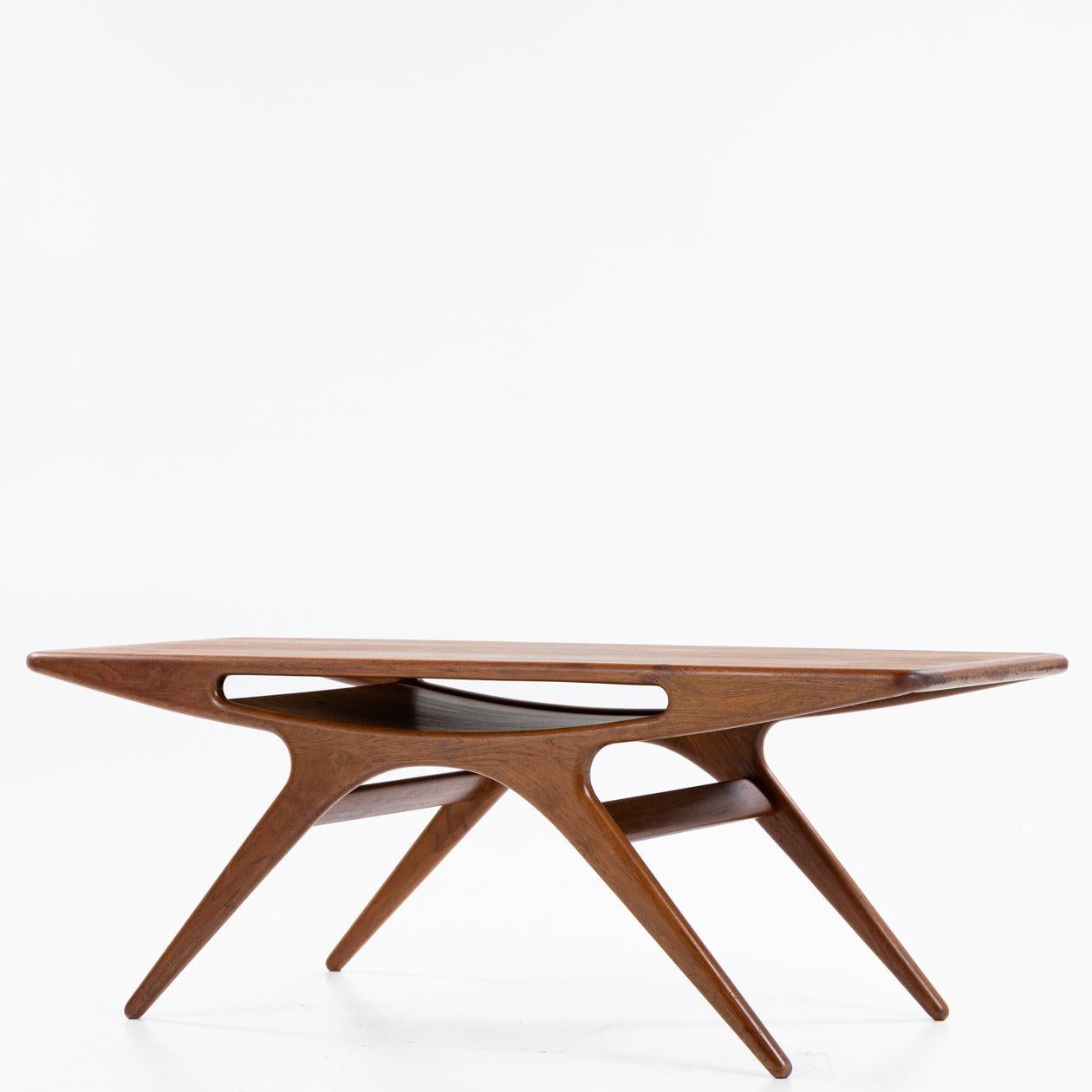 ’The Smile' coffee table in teak.
Manufactered by CFC Silkeborg