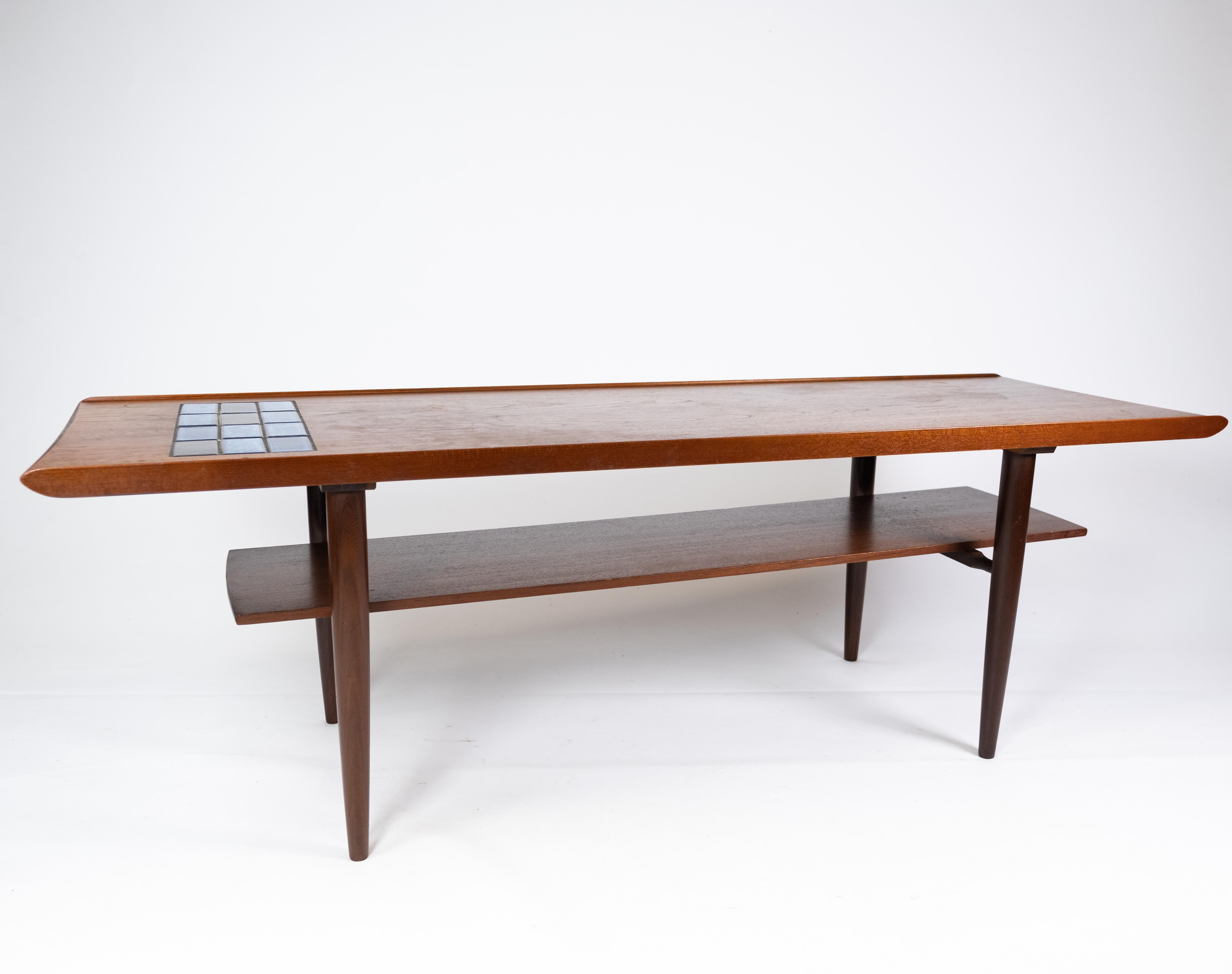 Coffee table in teak with blue tiles of Danish design from the 1960s. The table is in great vintage condition.
  
