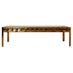 Coffee table in the style of Roberto Rida, golden brass and glass, circa 2000.