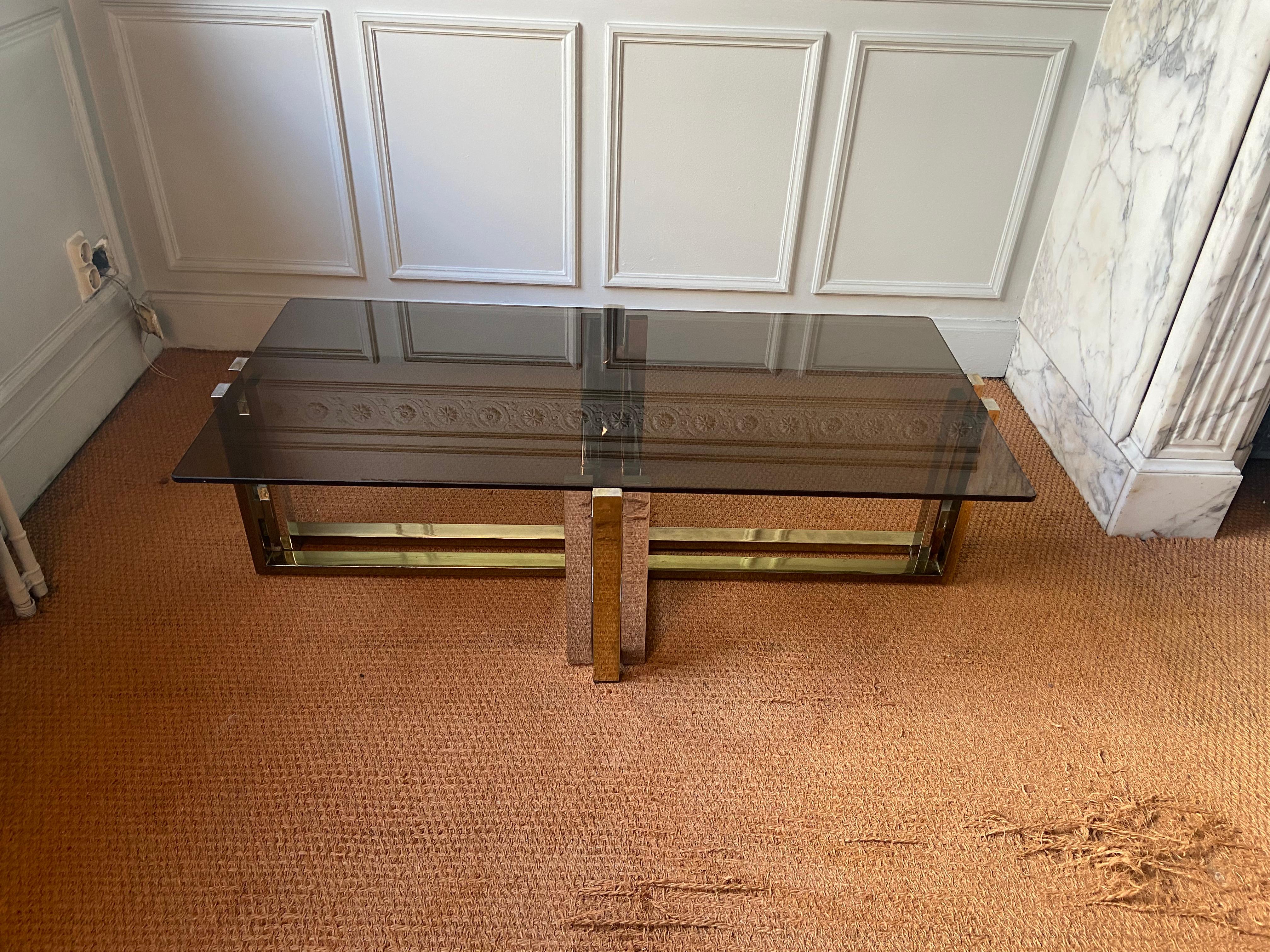 
Coffee table in the style of willy rizzo, belgo chrom or maison charles. Structure in chromed and gilded metal. Smoked glass top. Glass and chrome are in very good condition. Some traces of wear on the gilding as shown in the photos