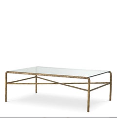 Table basse en finition laiton vintage avec verre transparent