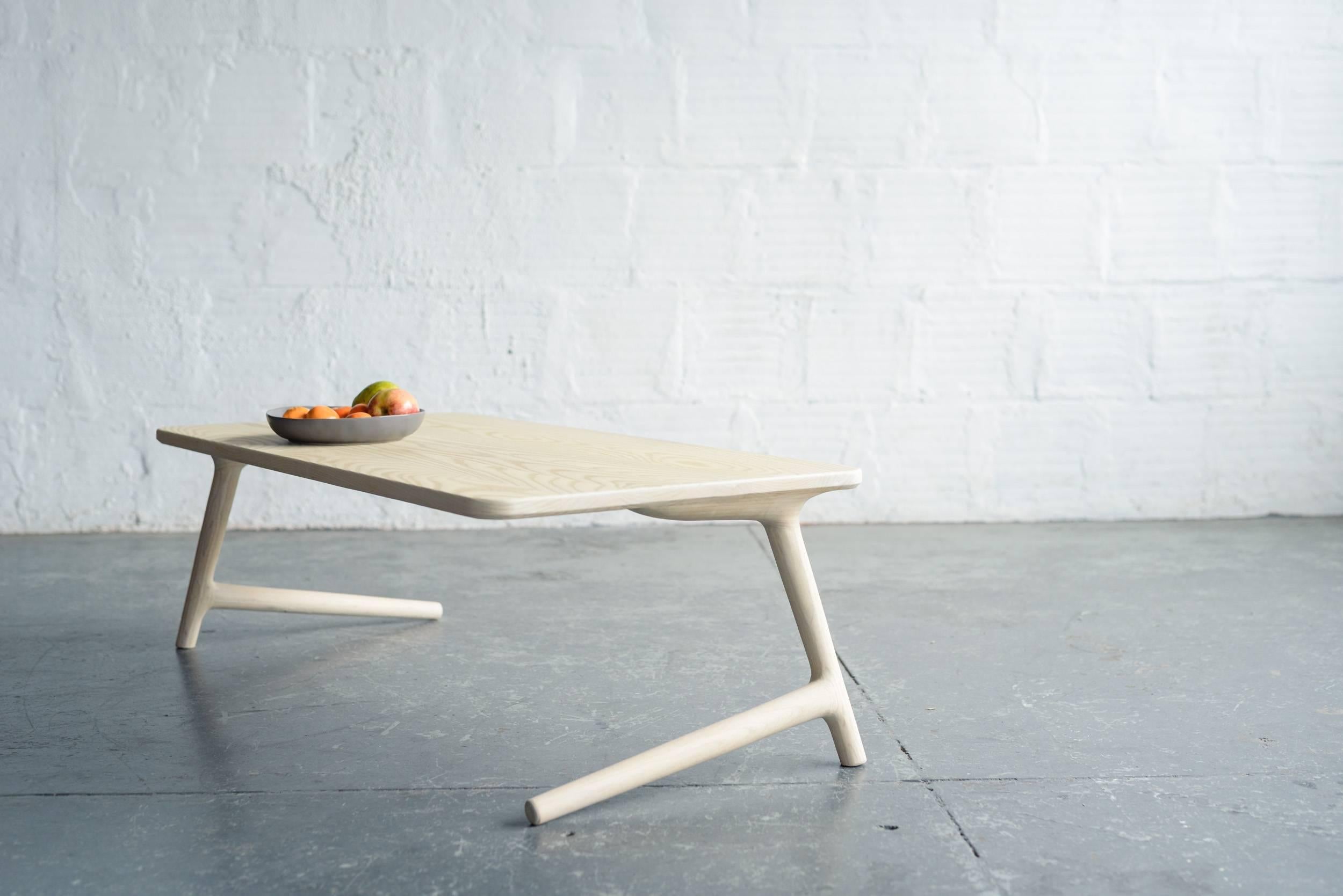 A beautiful, minimal coffee or cocktail table for your home in the Mid-Century Modern or Danish style. Handmade from White Ash wood. The legs give this piece a light, airy feel, while strong joinery keeps it stable and sturdy. (See the second photo