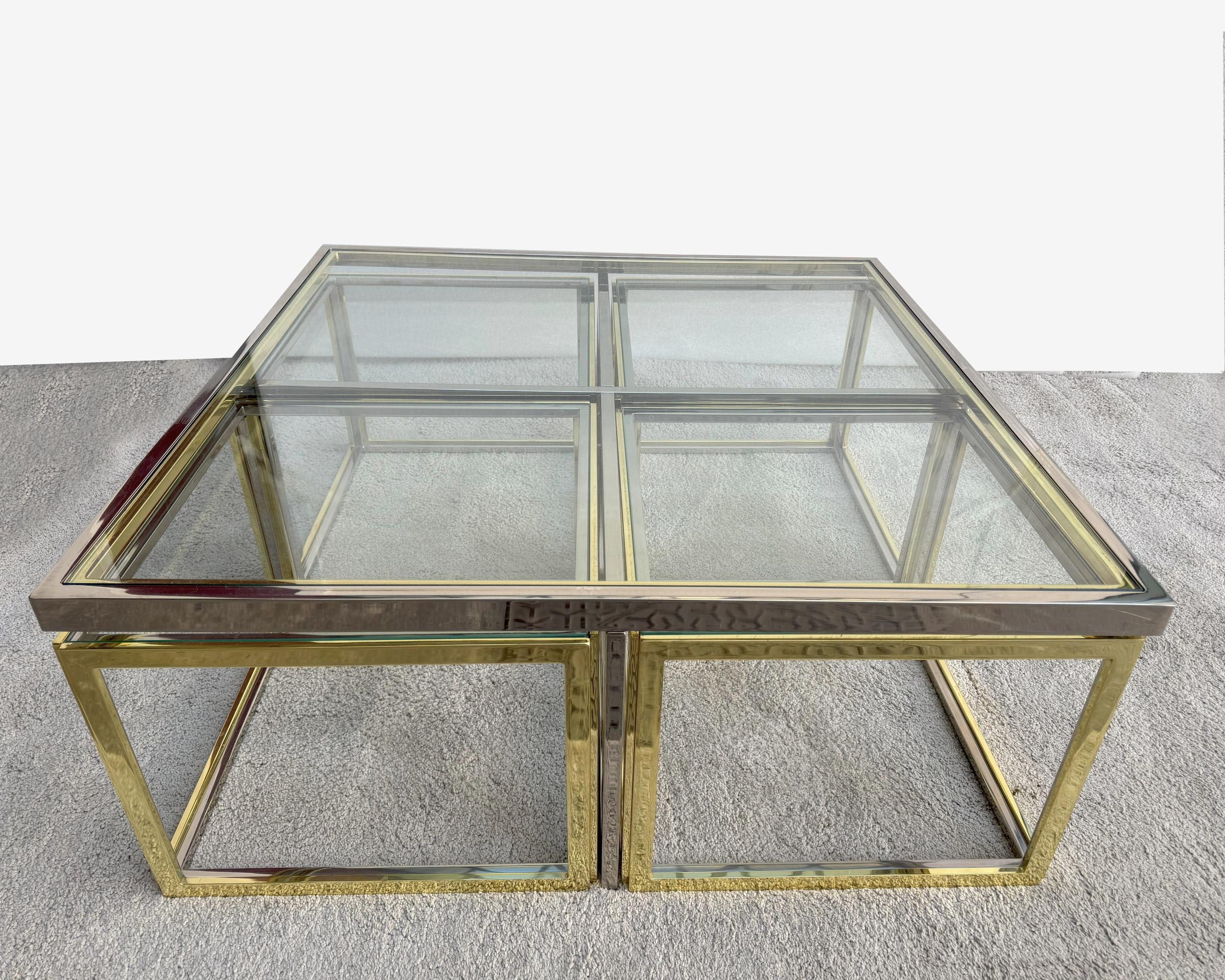 Large square coffee table by Jean Charles, France 1970, including four nesting side tables. Chrome-plated steel, polished brass and glass. The tables can be used separately.

Each of the four nesting tables measures 50,5 x 50,5 cm (19.9 x 19.9