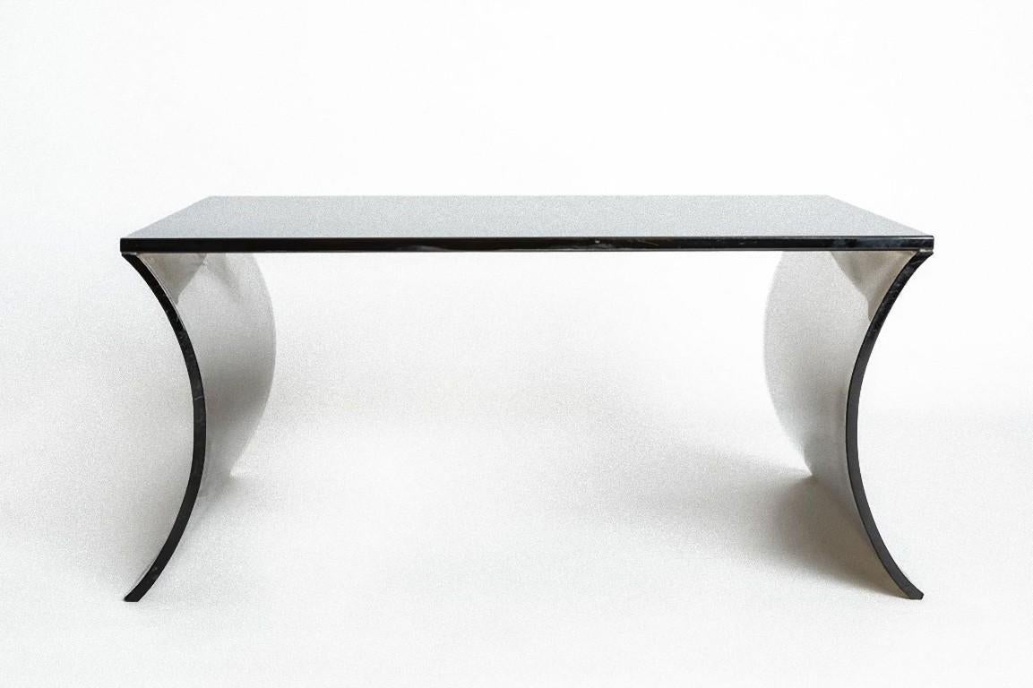 Coffee table is a piece of original design furniture realized in the 1970s by Italian Manufacture.

Elegant coffee table in black curved crystal.

 