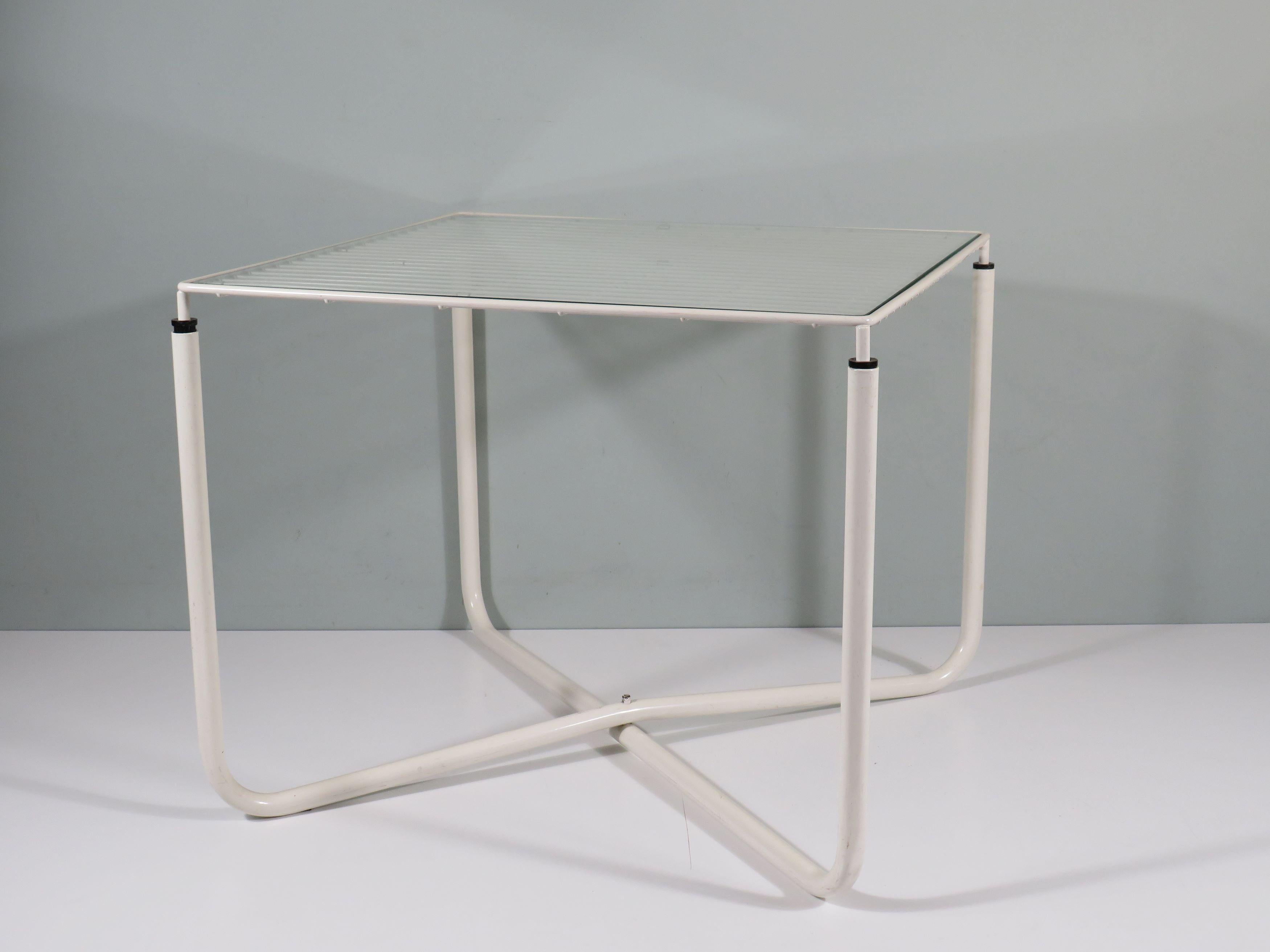 Post Modern white lacquered metal coffee table or side table ' Jarpen' with original transparent glass top.