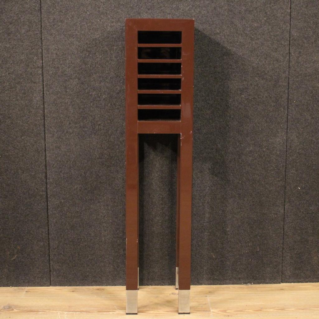 Italian open cabinet from the 1980s. Wooden cabinet lacquered with metal feet adorned with the Valentino fashion logo (see photo) equipped with 6 small front compartments. Column finished from the center of particular proportion, easily inserted in