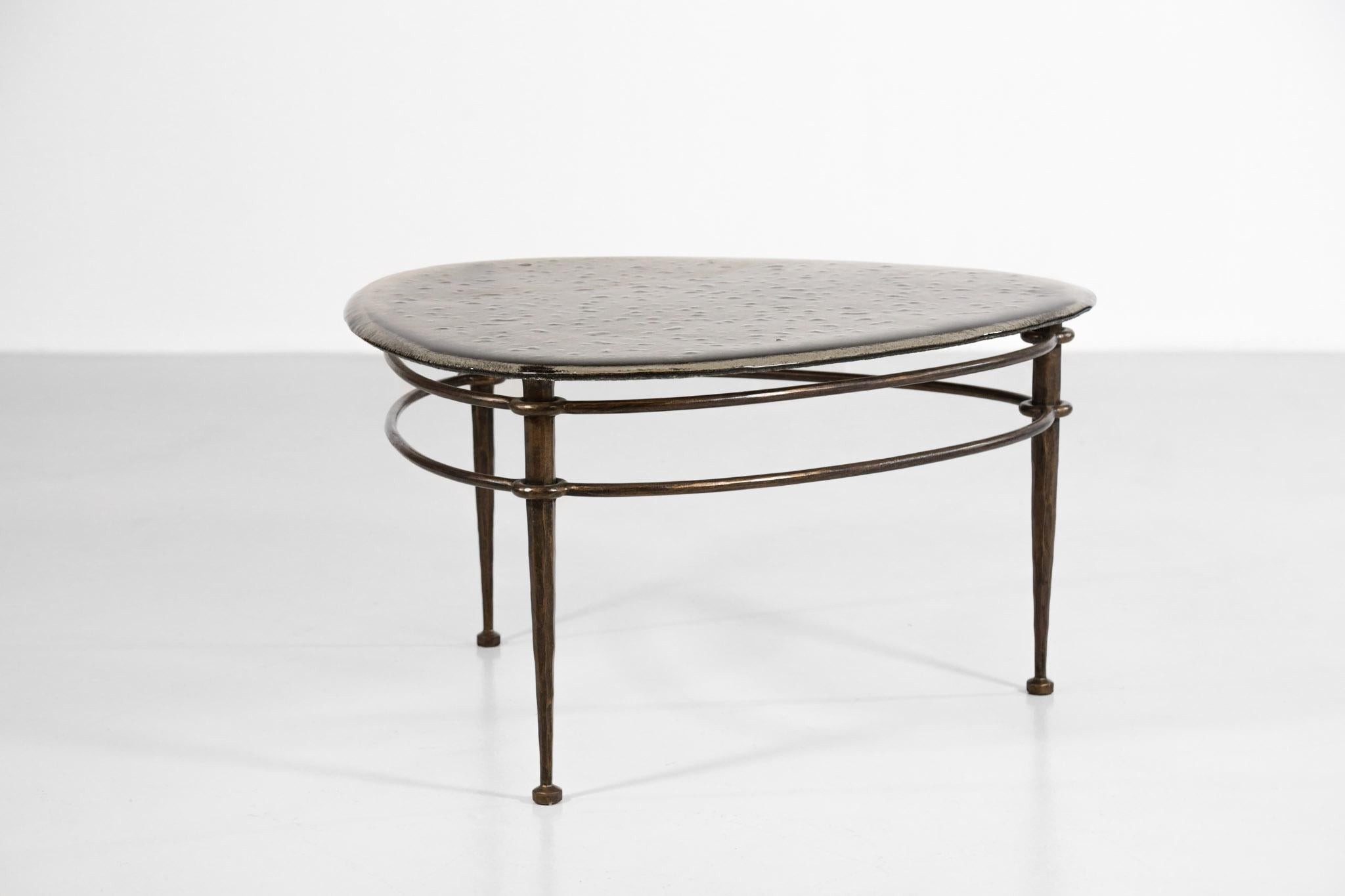 Beautiful bronze coffee table by the German artist Lothar Klute. Solid bronze structure and glass top on a tripod base. Excellent vintage condition (see pictures).
 