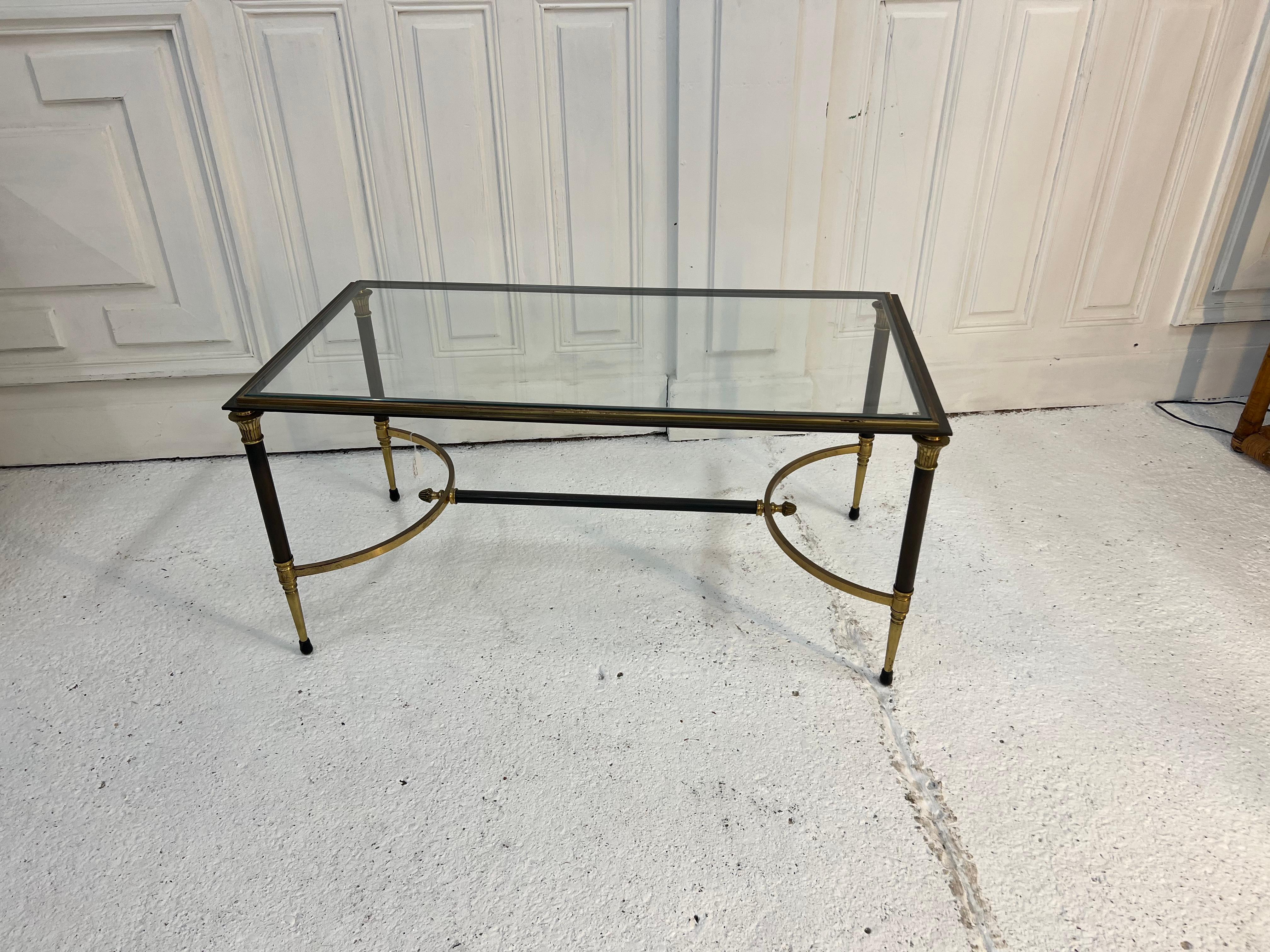 magnificent two-tone bronze coffee table (golden and gunmetal) from Maison Charles
the edition is typical of the 1950s, its beveled glass top gives it its very Frenchie look


The year 1959 marked a turning point in the history of the house.