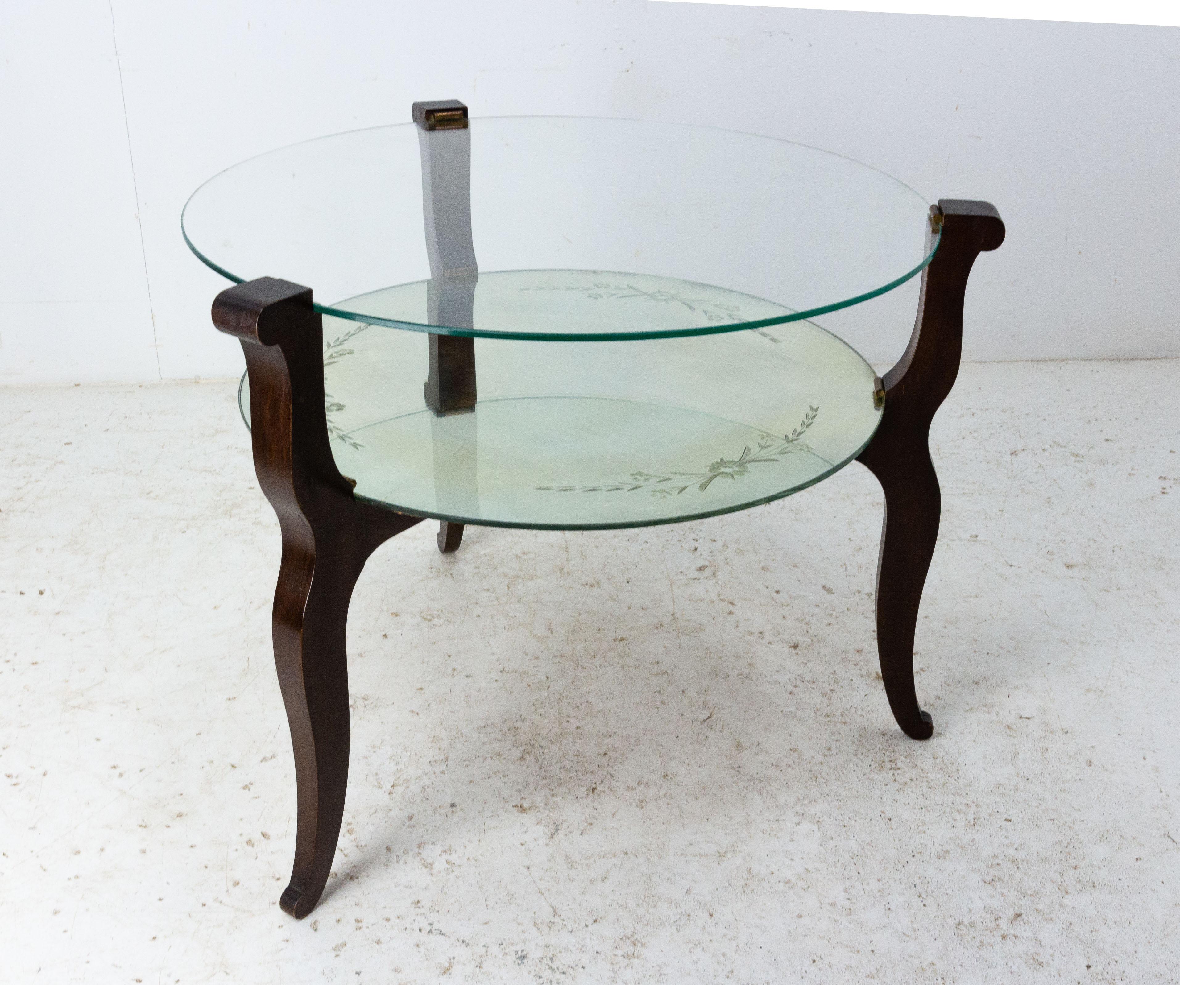 Coffee table with glass top and engraved mirror
The top and the shelve are sustained by three wood elegant legs and brass supports.
France circa 1960
In good original condition with only minor marks nothing distracting (please see photo).

 

