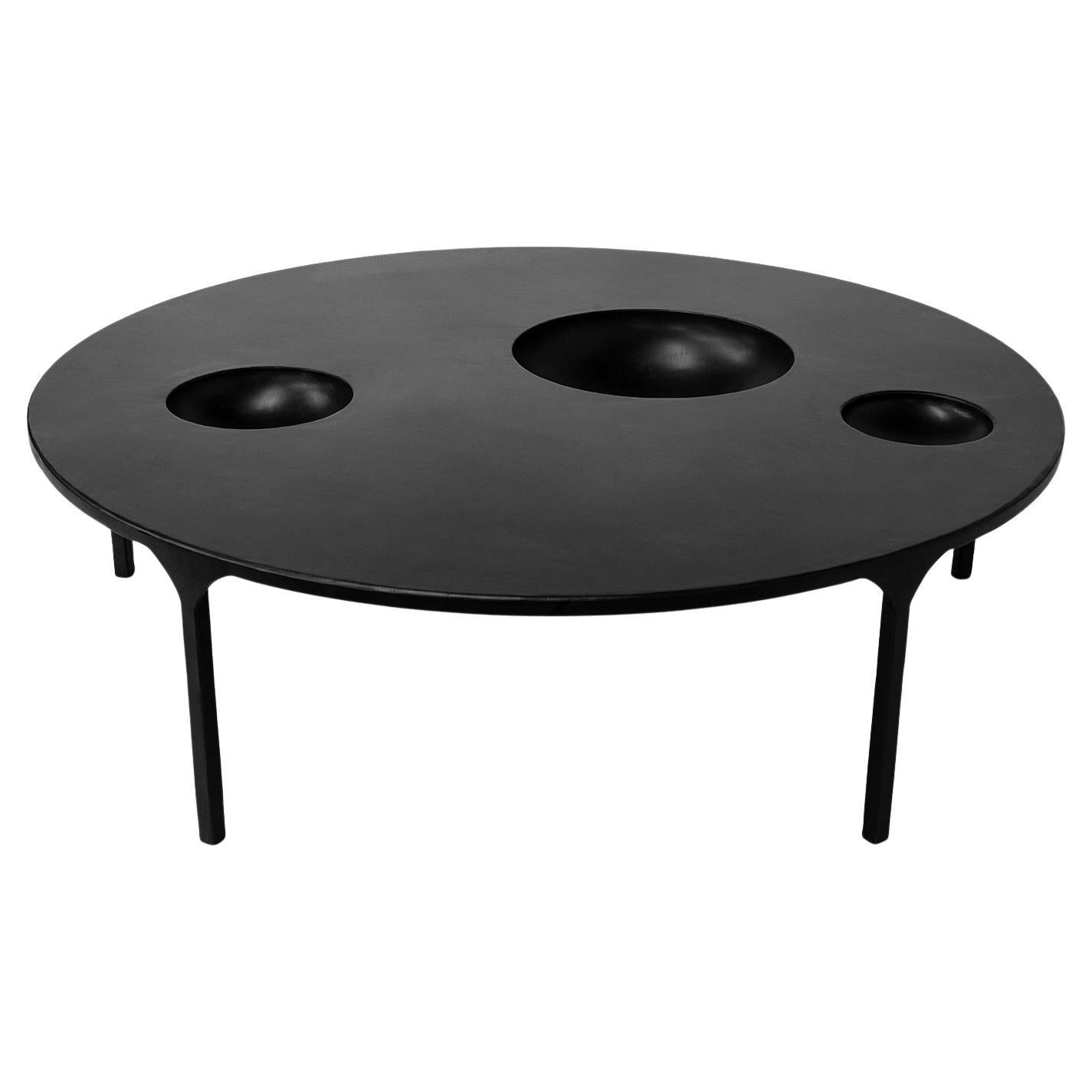 TABLE NO. 11 - Round
J.M. Szymanski
d. 2021

Handmade entirely out of blackened and waxed steel, this table features geometric voids within the table itself. Also available with food-safe, ceramic, bowl inserts. Each one is made specifically to our