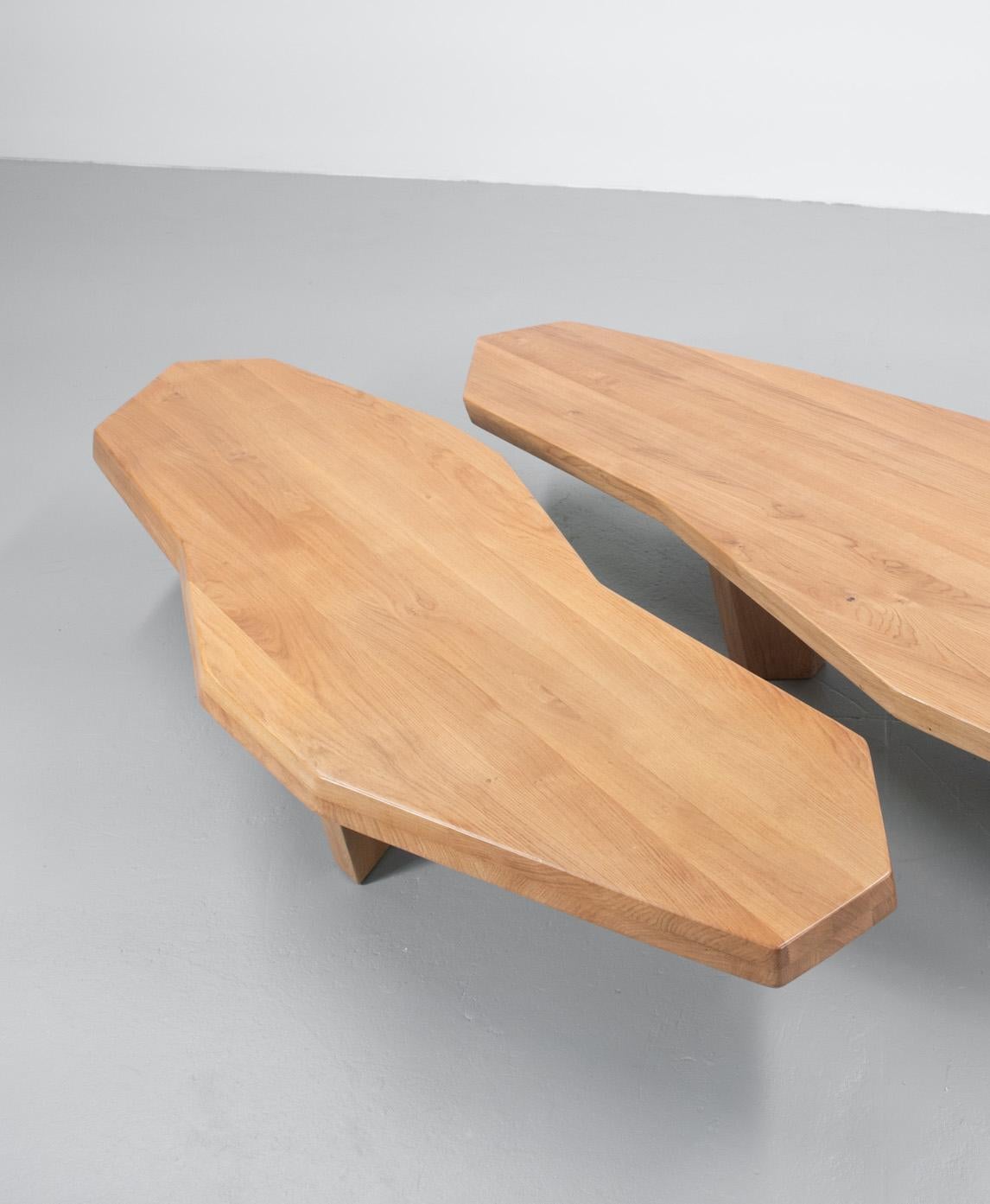 Coffee tables in oak. The angular shapes are cut at angles on the edges so the lines seem to prolong in space. The 
The legs feel animated.