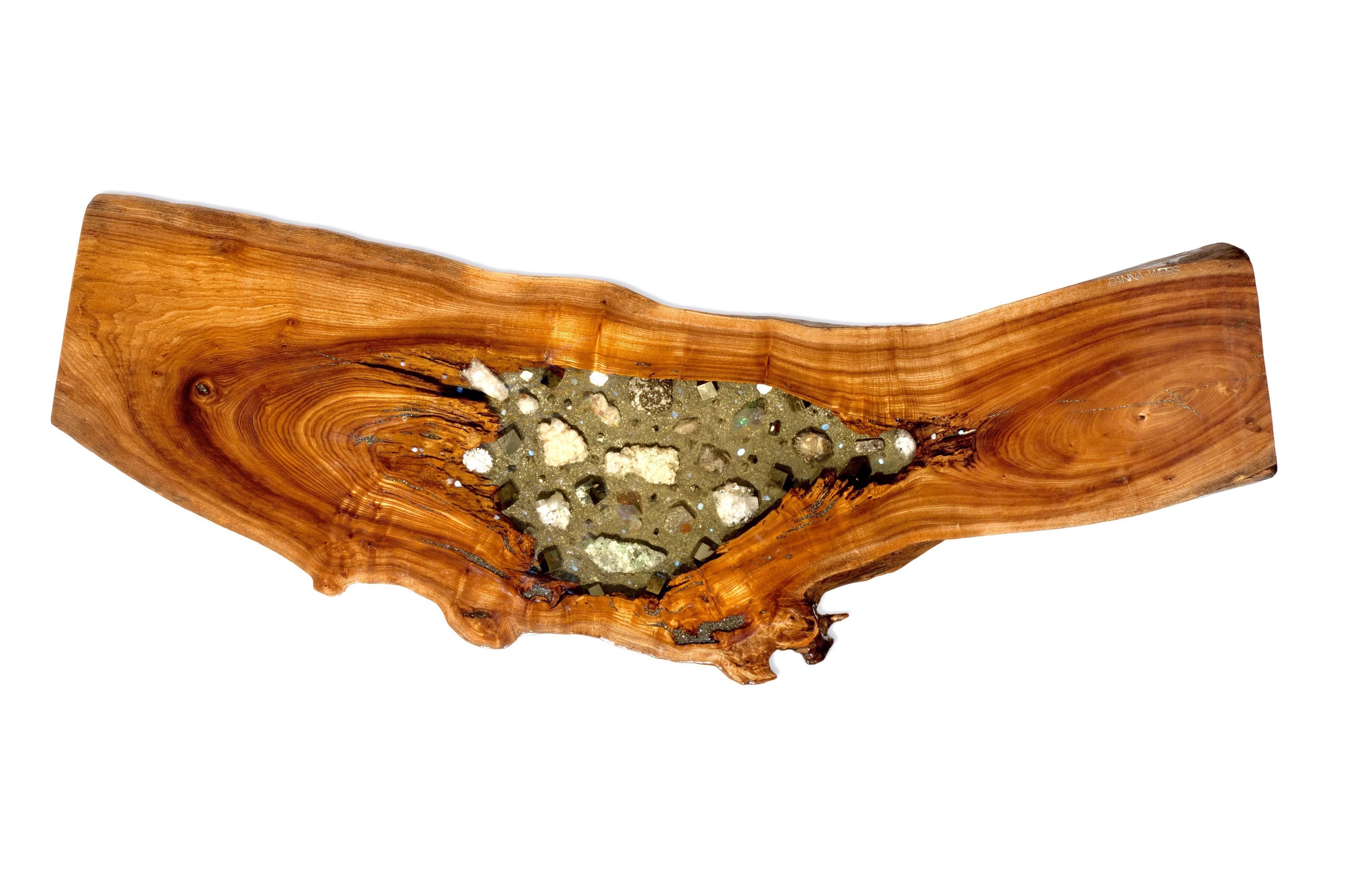 This is an incredible, one of a kind, handmade coffee table in four inch thick English Elm. Its crystal and gemstone inlay has the most wonderful specimens of Rainbow Opal, Apotholite, Calcite, rare Pyrite cubes, Danburite, Rainbow Painted Quartz,