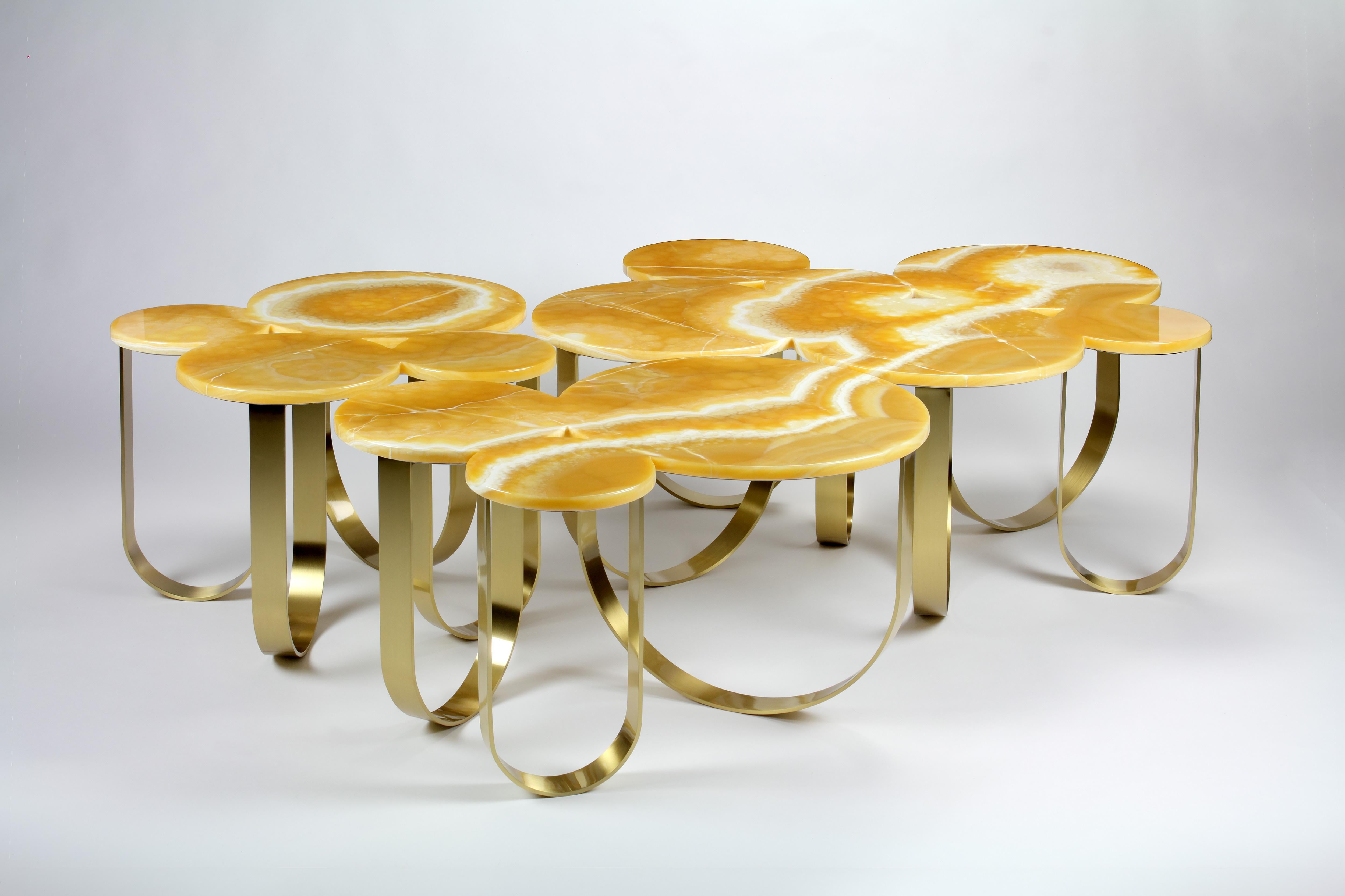 The 'Cloud' is a spectacular coffee table with structure in brushed brass and top in orange onyx. This coffee table consists of three different sized pieces, all have a different shape and size and are composable to your taste. The brushed finishing