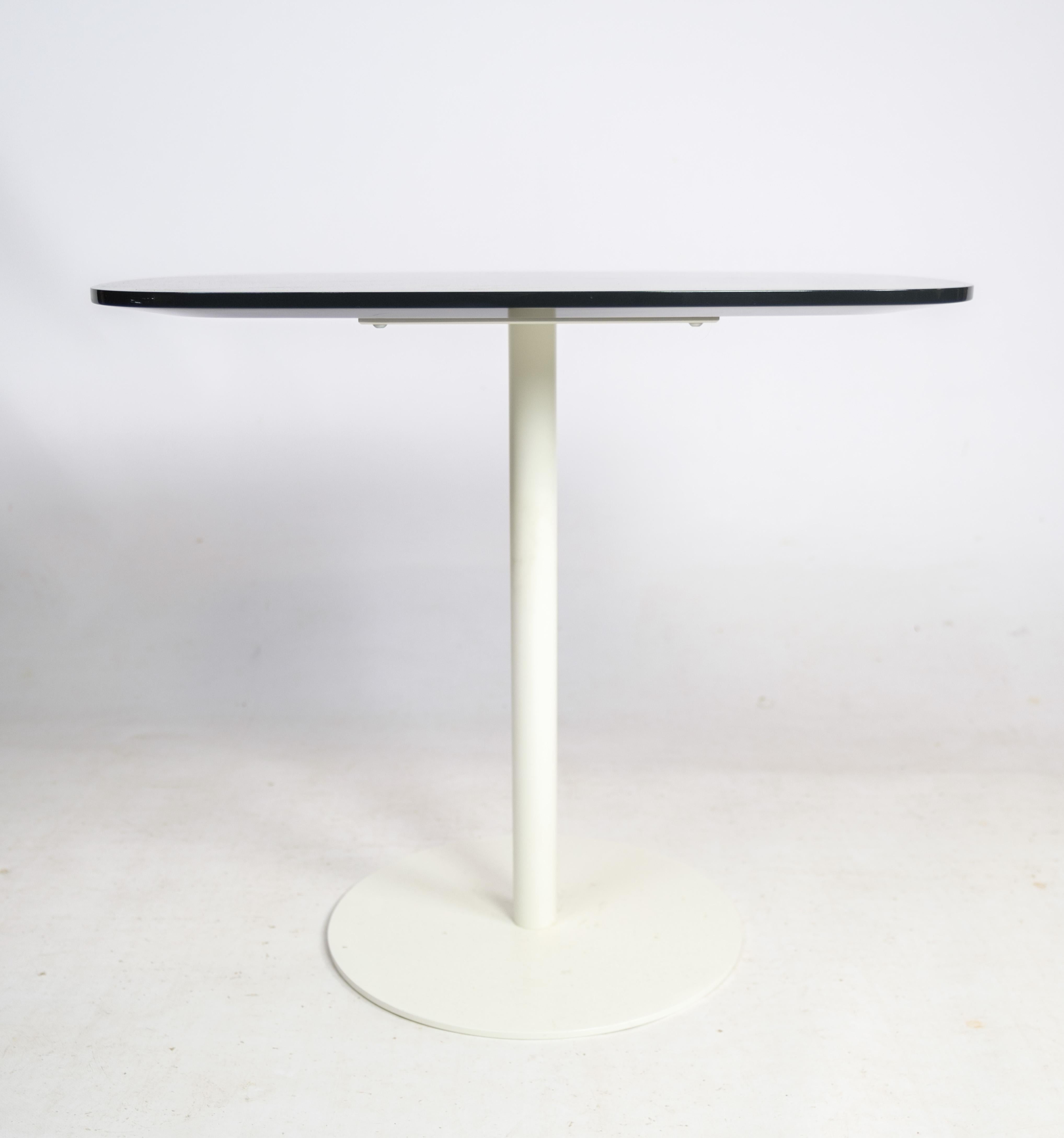 Coffee table, designed by Piero Lissoni with base in white lacquered metal, top in MDF, high gloss lacquered in the color anthracite manufactured by Fritz Hansen in 2006.

This product will be inspected thoroughly at our professional workshop by